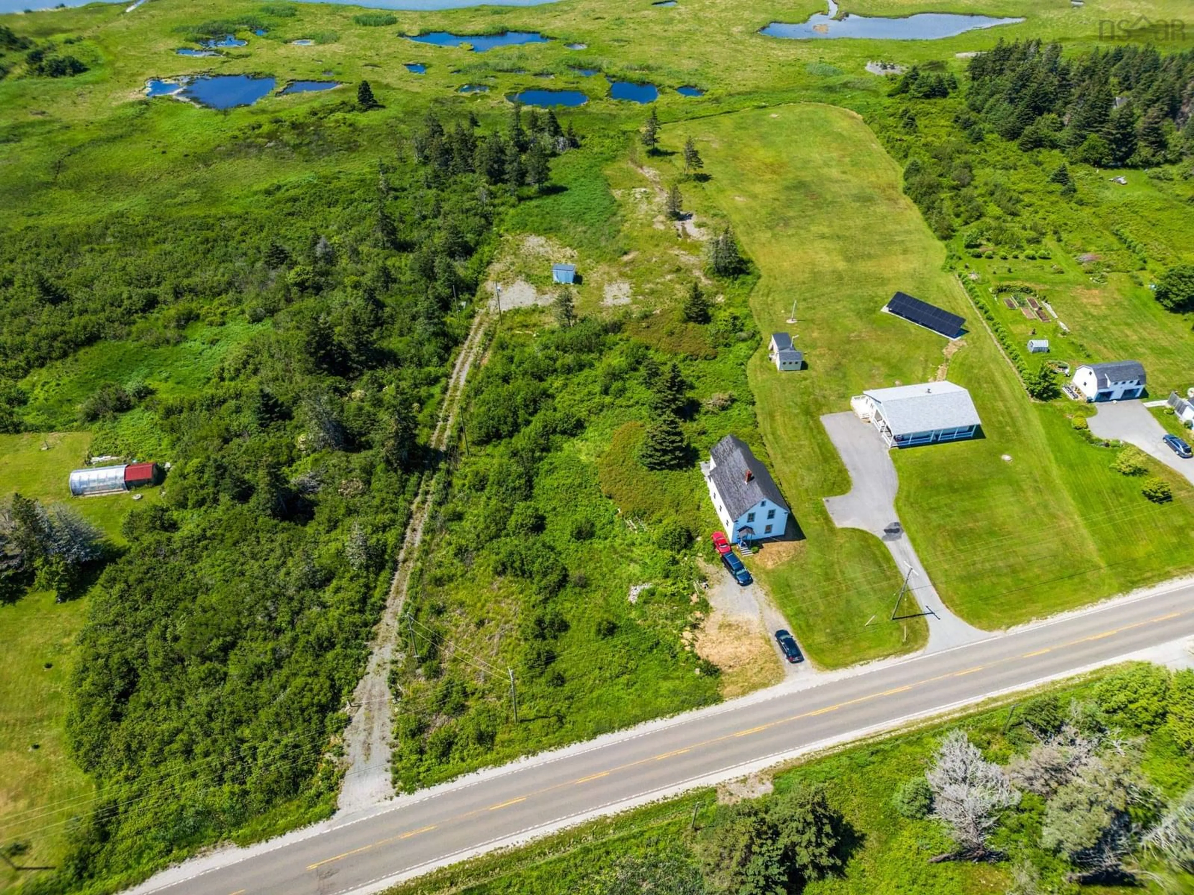 A pic from outside/outdoor area/front of a property/back of a property/a pic from drone, water/lake/river/ocean view for 2337 Highway 1, Grosses Coques Nova Scotia B0W 1M0