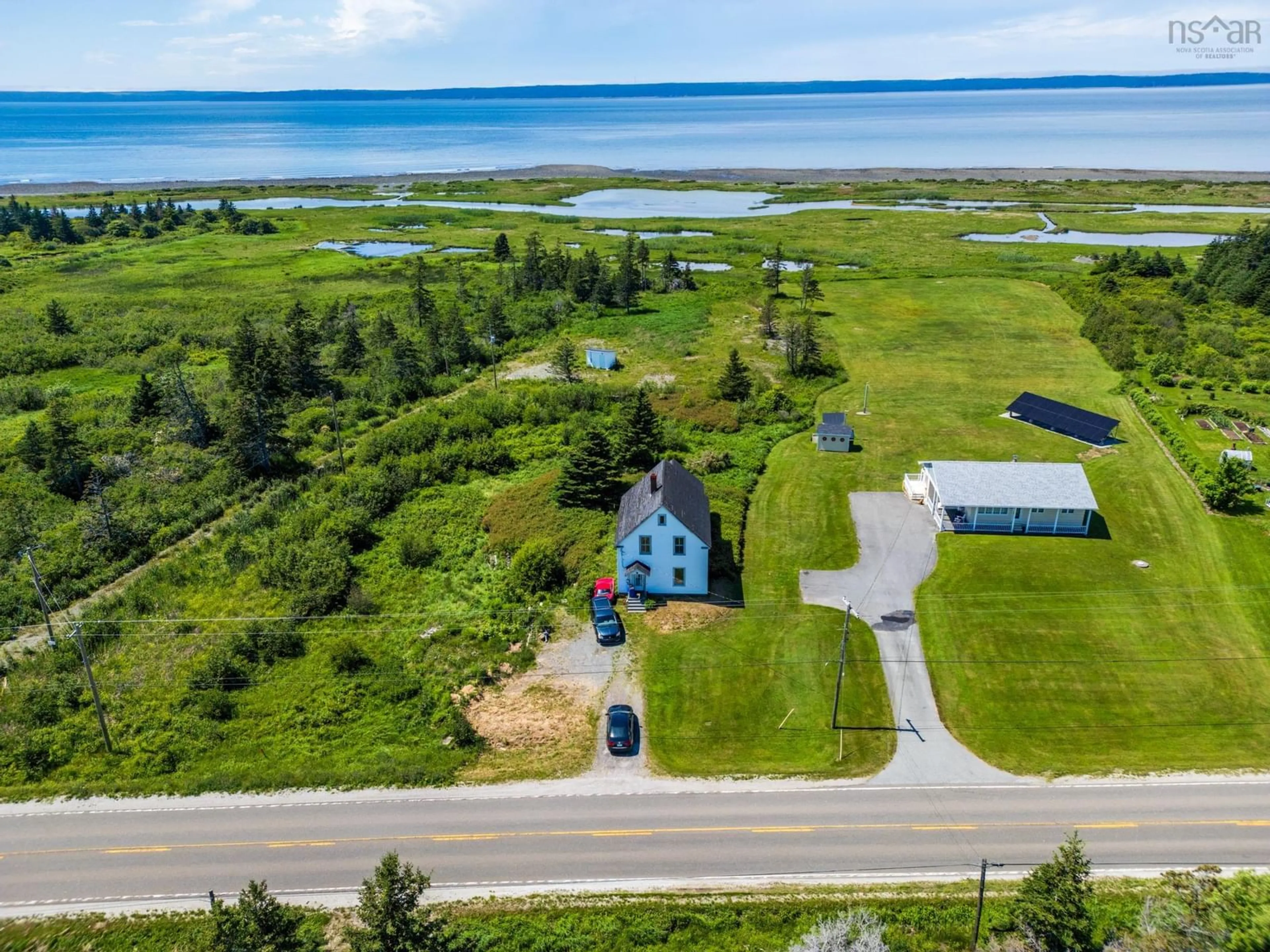 A pic from outside/outdoor area/front of a property/back of a property/a pic from drone, water/lake/river/ocean view for 2337 Highway 1, Grosses Coques Nova Scotia B0W 1M0