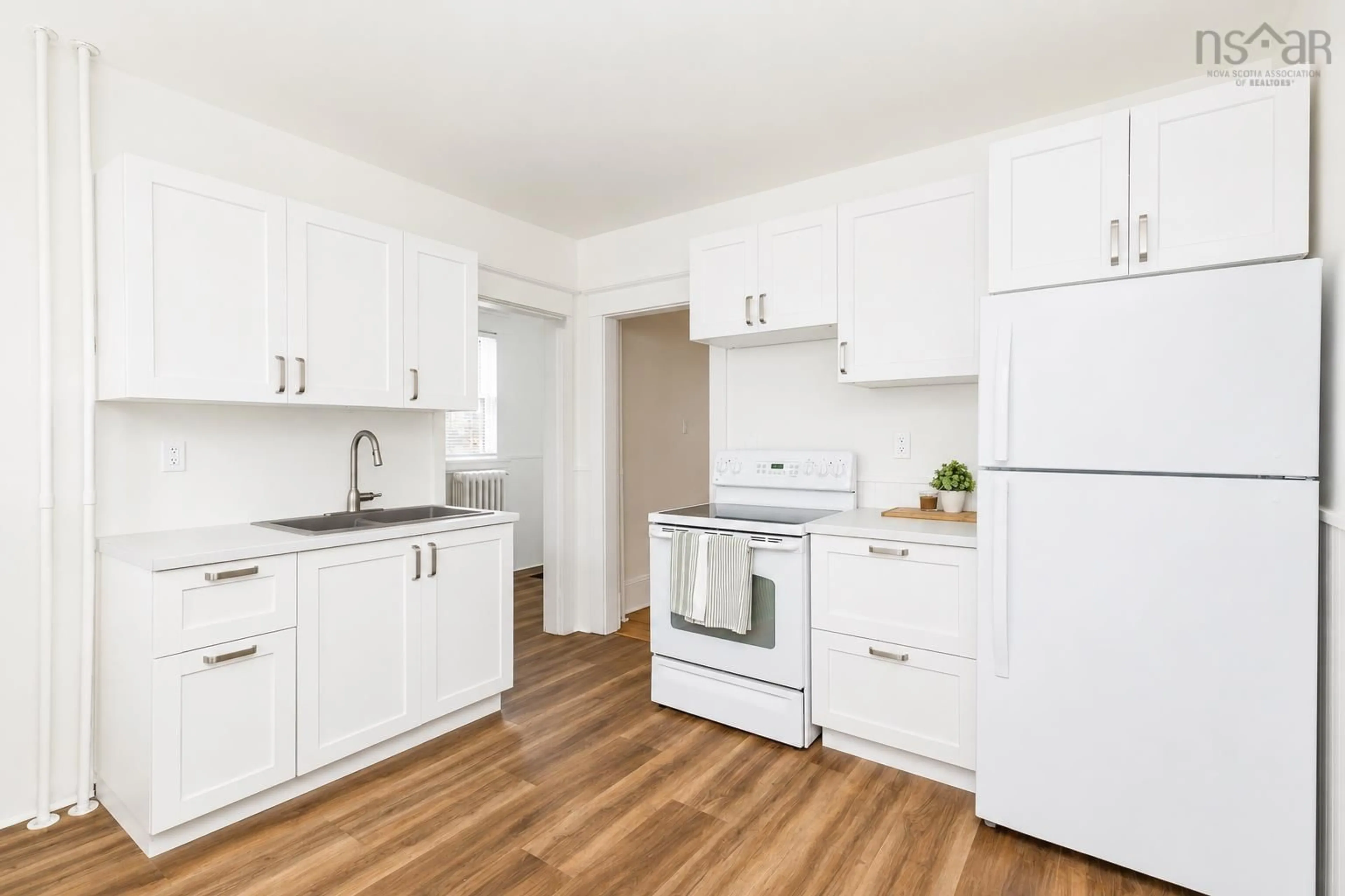 Standard kitchen, wood/laminate floor for 34 Matilda St, Whitney Pier Nova Scotia B1N 2T4