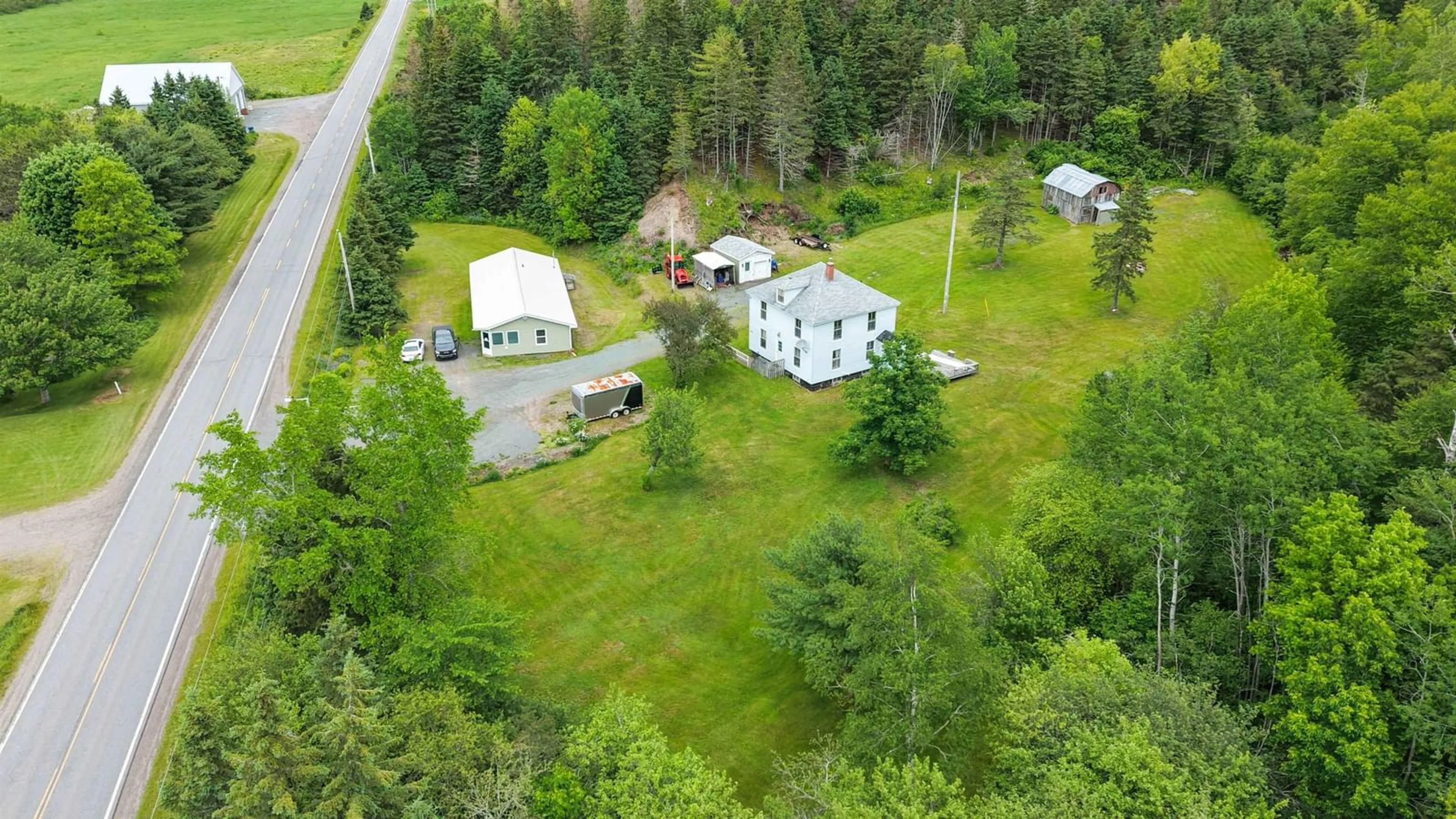 A pic from outside/outdoor area/front of a property/back of a property/a pic from drone, unknown for 1980 Highway 7, North Lochaber Nova Scotia B2G 2L3