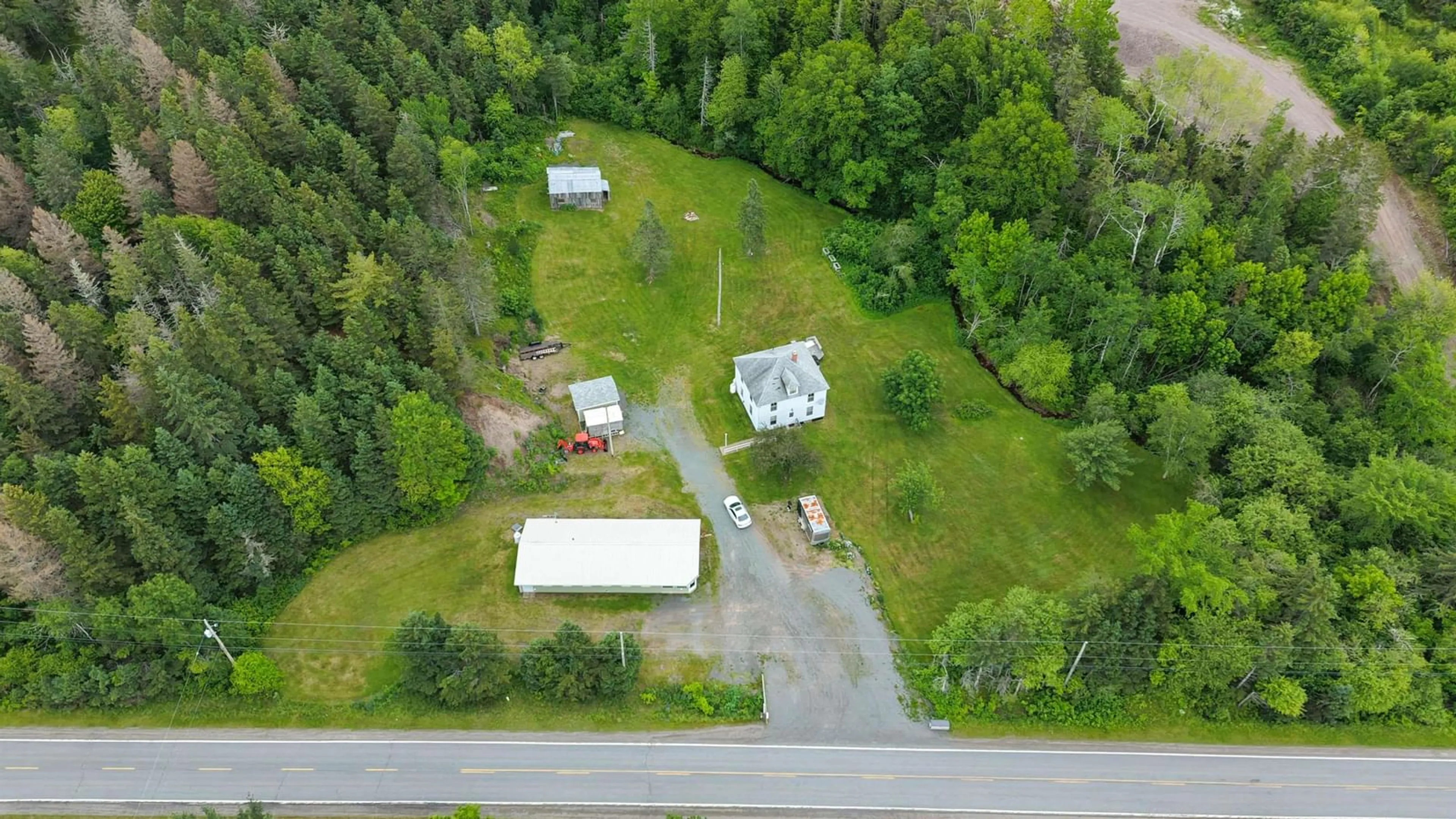 A pic from outside/outdoor area/front of a property/back of a property/a pic from drone, unknown for 1980 Highway 7, North Lochaber Nova Scotia B2G 2L3