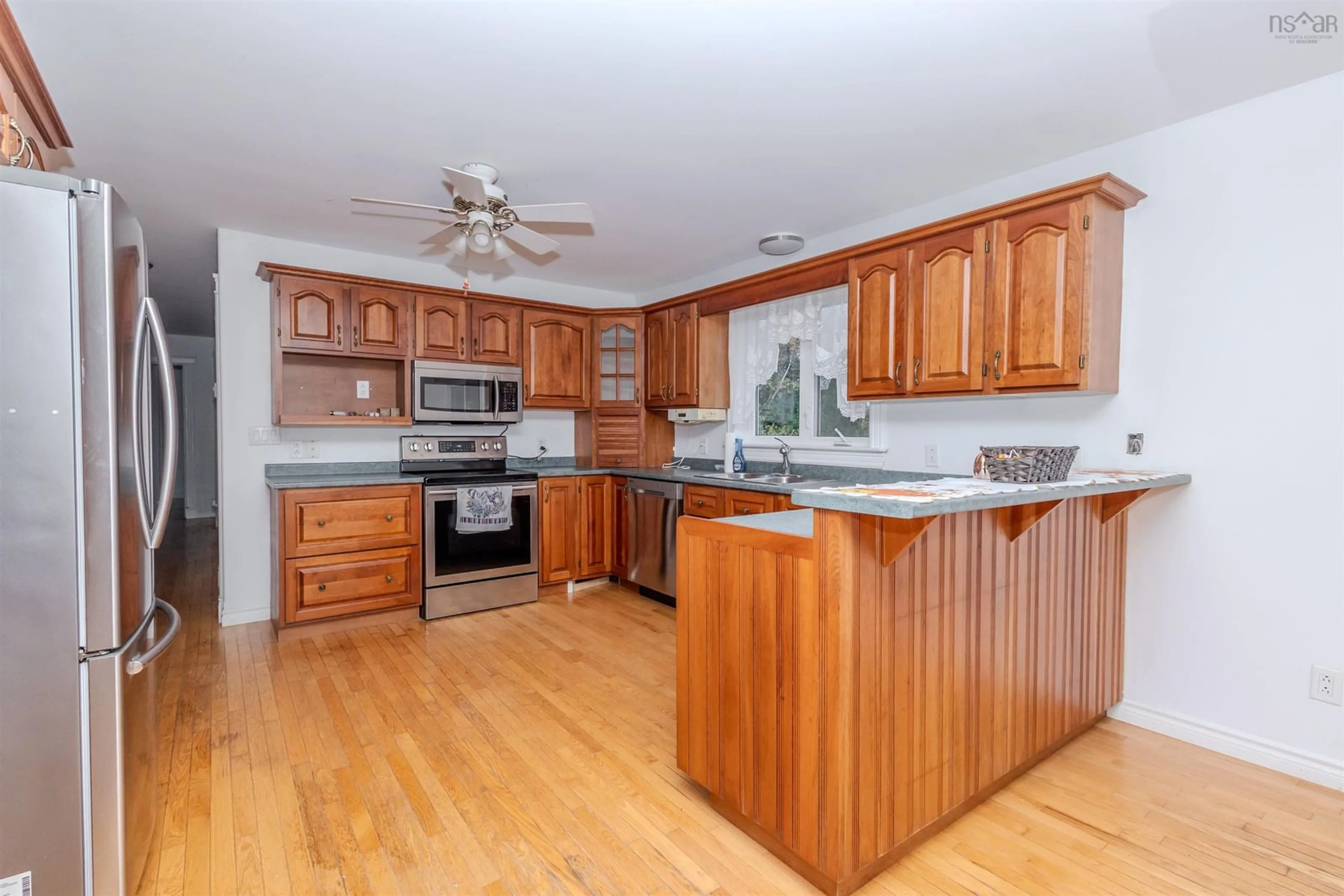 Open concept kitchen, wood/laminate floor for 103 Paradise Rd, Albert Bridge Nova Scotia B1K 3R4