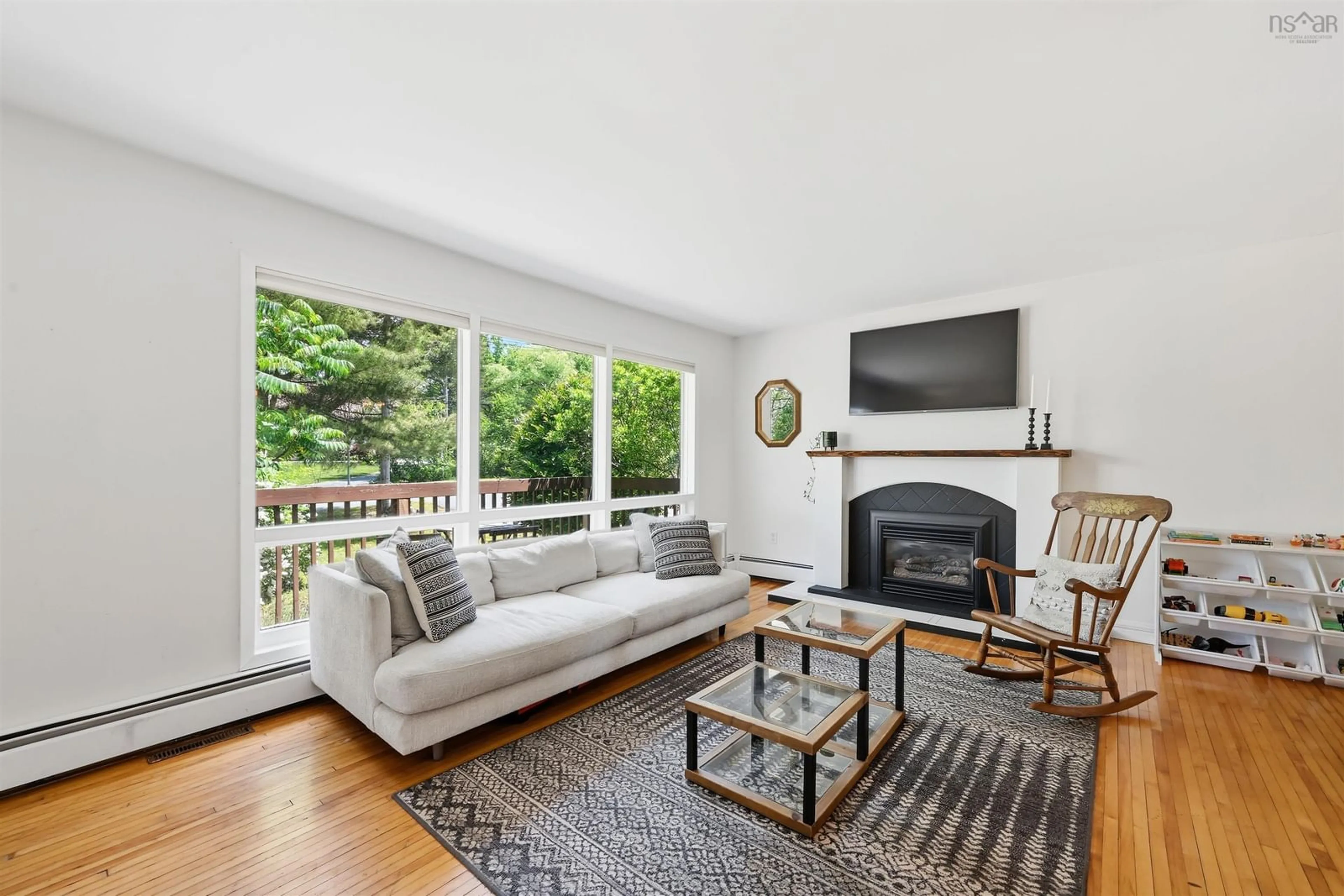 Living room with furniture, wood/laminate floor for 21 Lewis Dr, Bedford Nova Scotia B4B 1C1