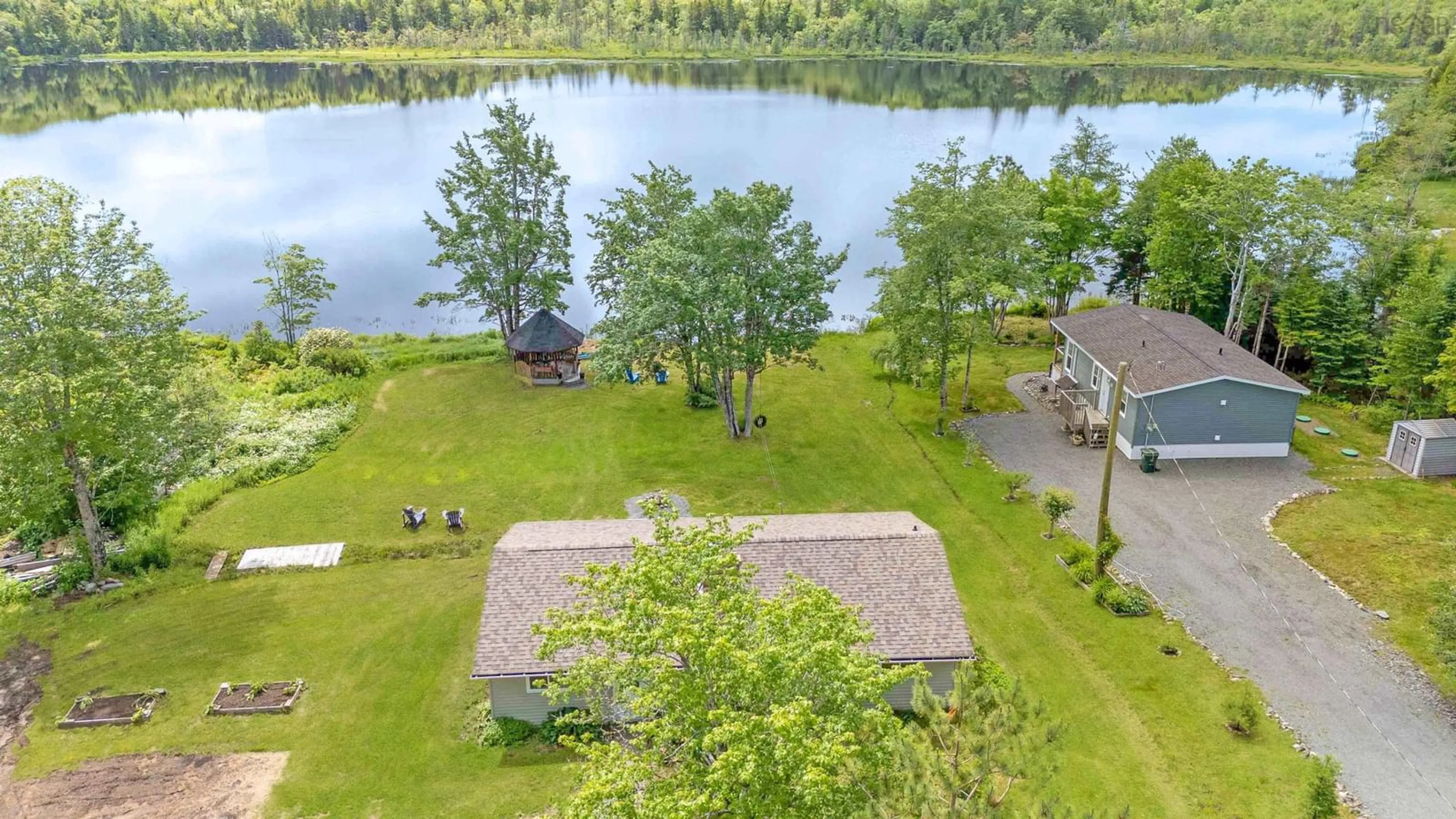 A pic from outside/outdoor area/front of a property/back of a property/a pic from drone, water/lake/river/ocean view for 110 Long Lake Rd, East Uniacke Nova Scotia B0N 1Z0