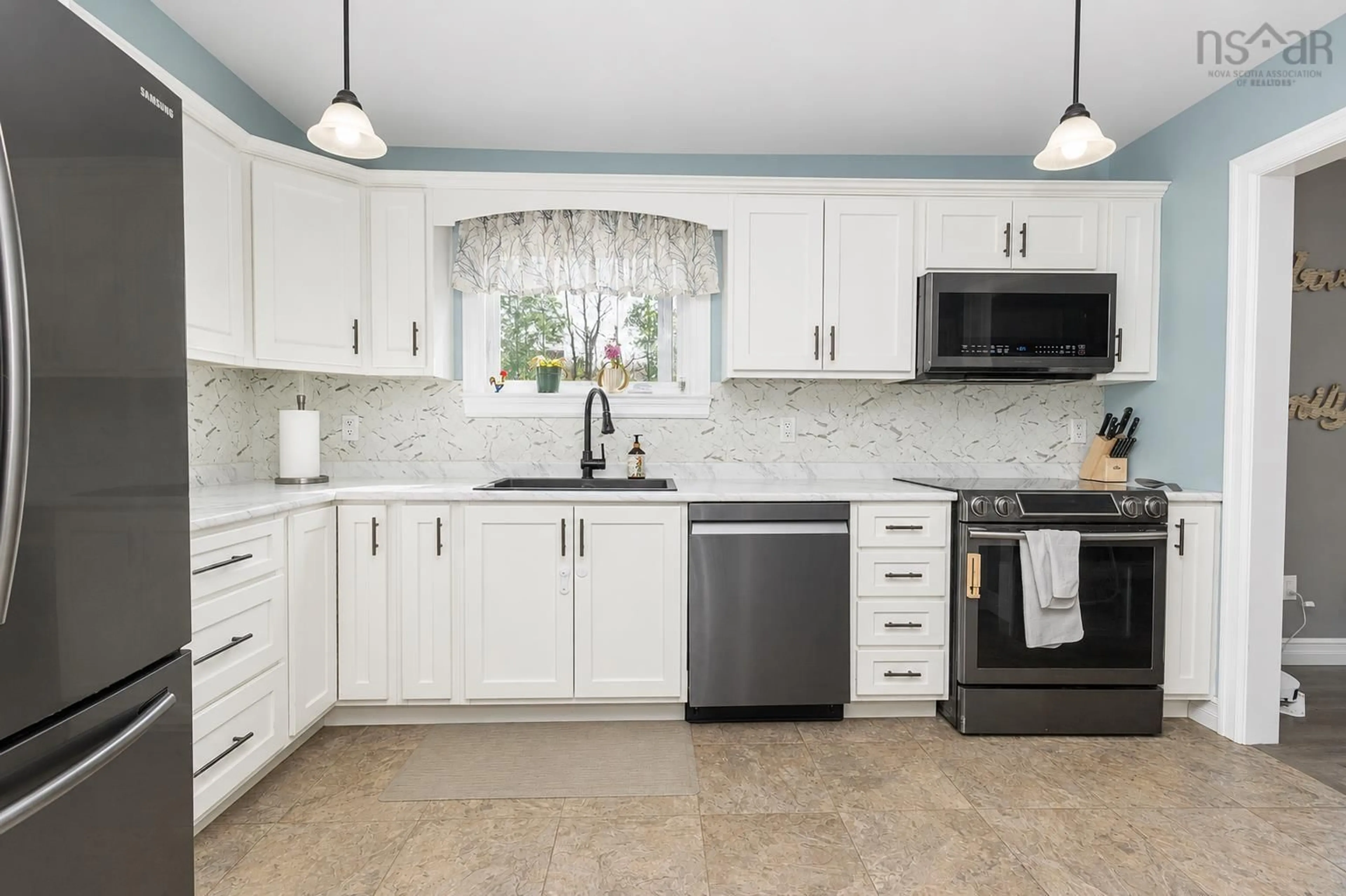 Open concept kitchen, ceramic/tile floor for 1851 Old Route 5 Hwy, Big Bras D'Or Nova Scotia B1X 1A5