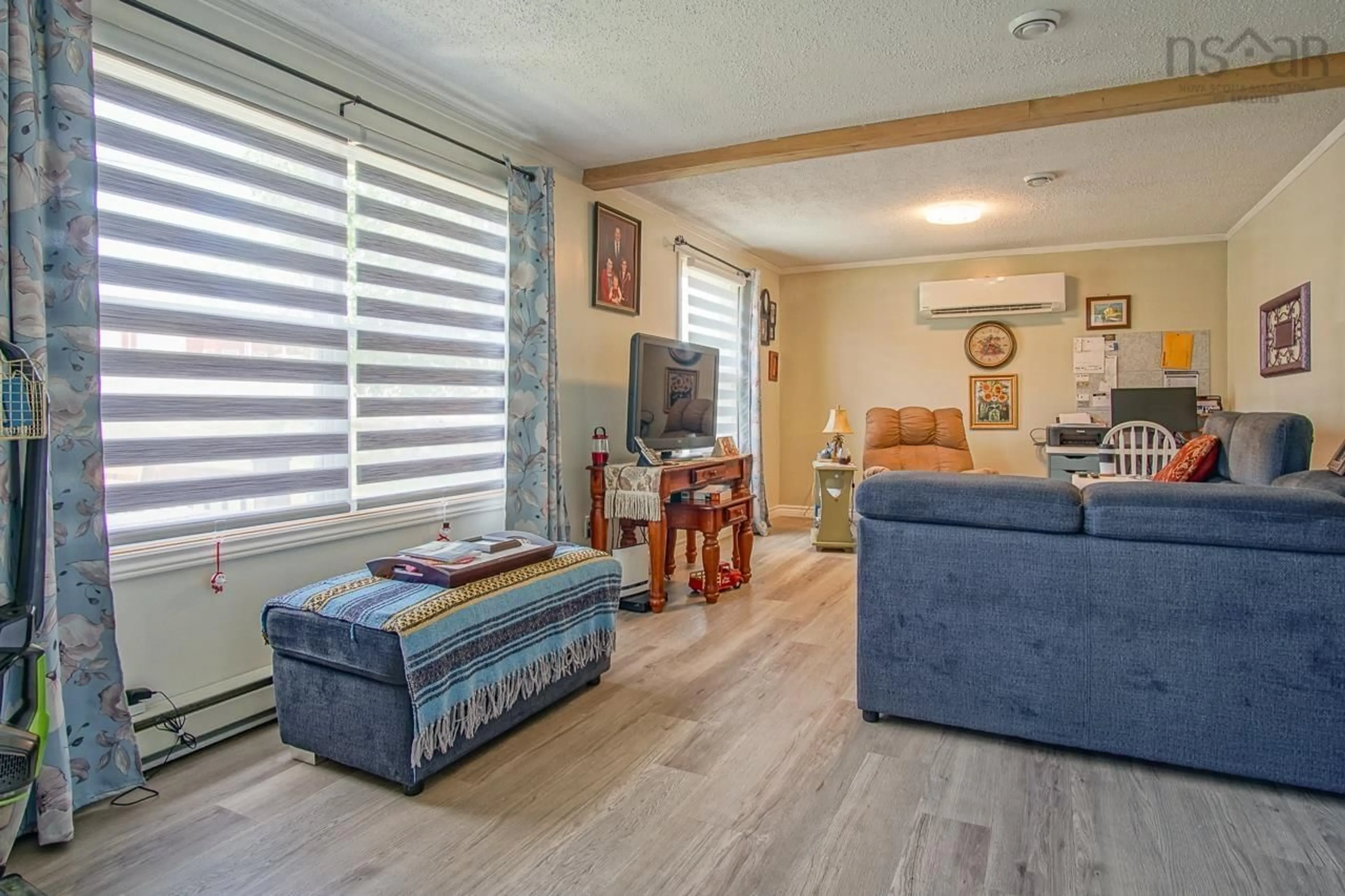 Living room with furniture, wood/laminate floor for 964 J. Jordan Rd, Canning Nova Scotia B0P 1H0