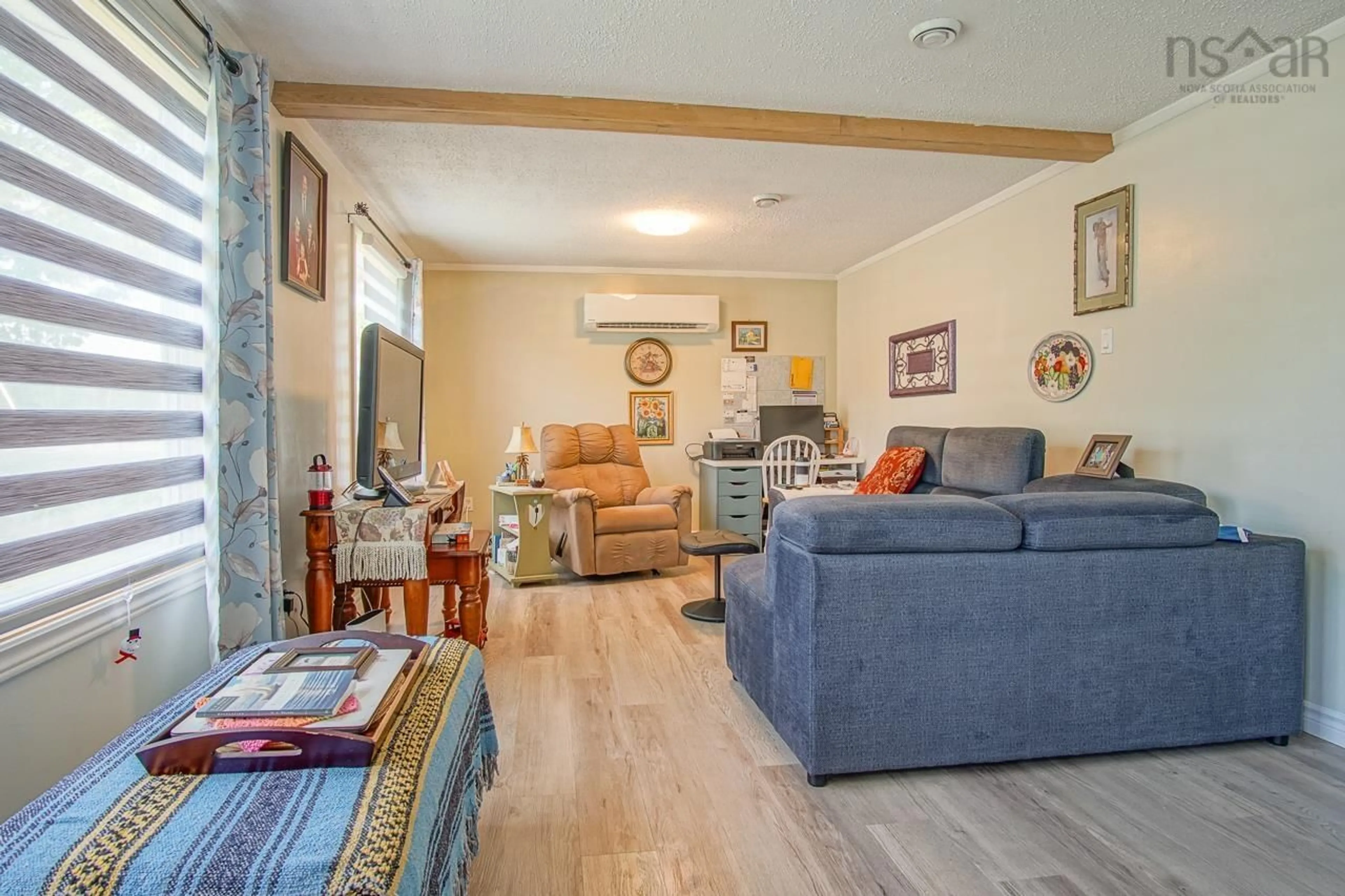 Living room with furniture, wood/laminate floor for 964 J. Jordan Rd, Canning Nova Scotia B0P 1H0