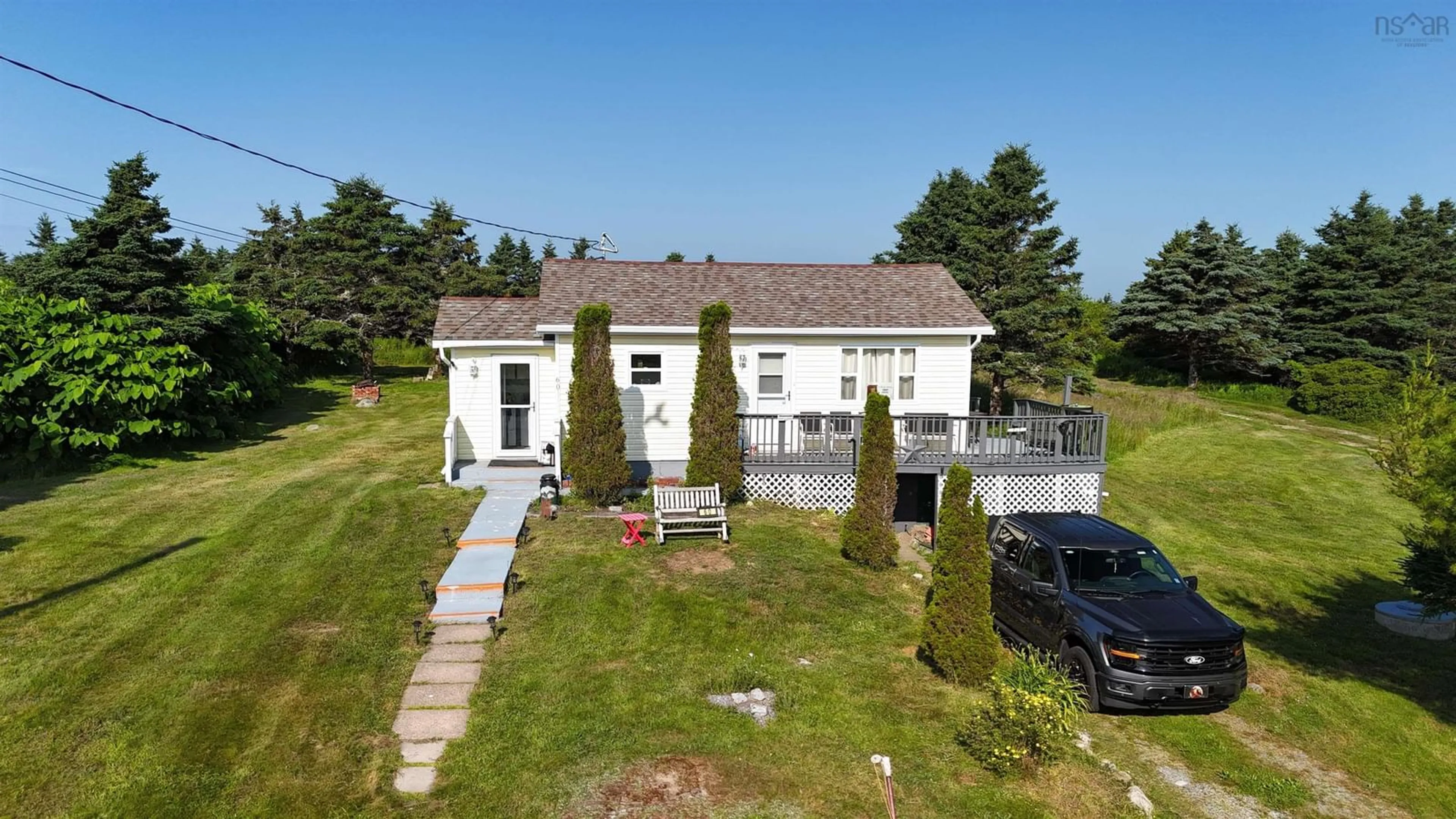A pic from outside/outdoor area/front of a property/back of a property/a pic from drone, building for 60 Red Schoolhouse Lane, North East Point Nova Scotia B0W 2P0