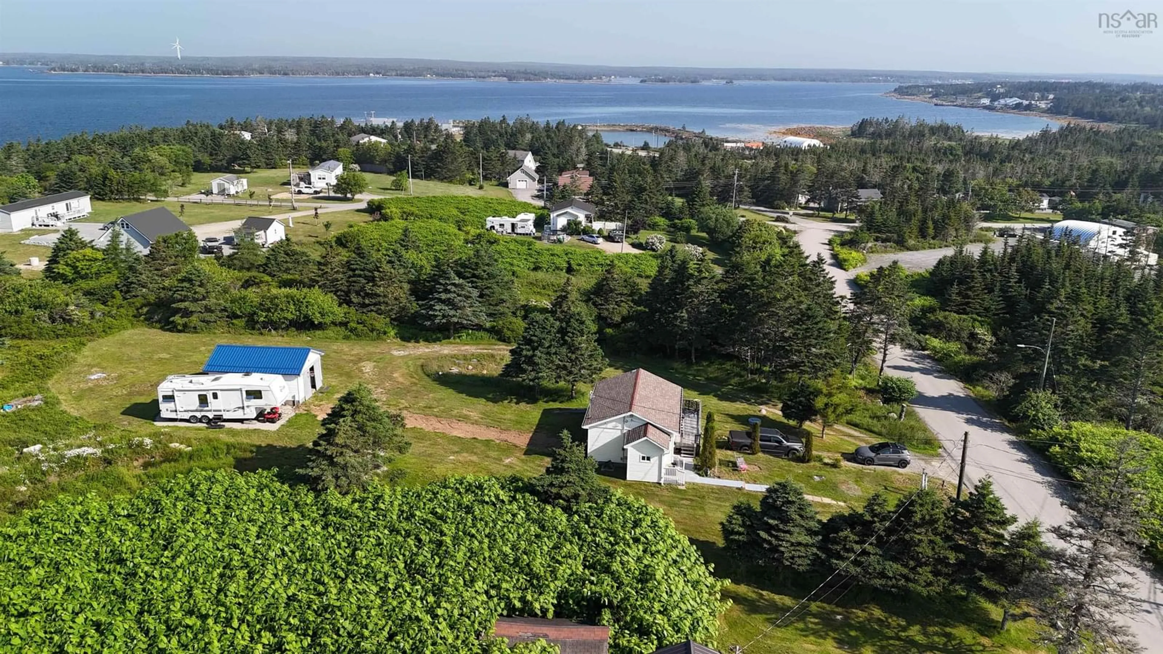 A pic from outside/outdoor area/front of a property/back of a property/a pic from drone, water/lake/river/ocean view for 60 Red Schoolhouse Lane, North East Point Nova Scotia B0W 2P0