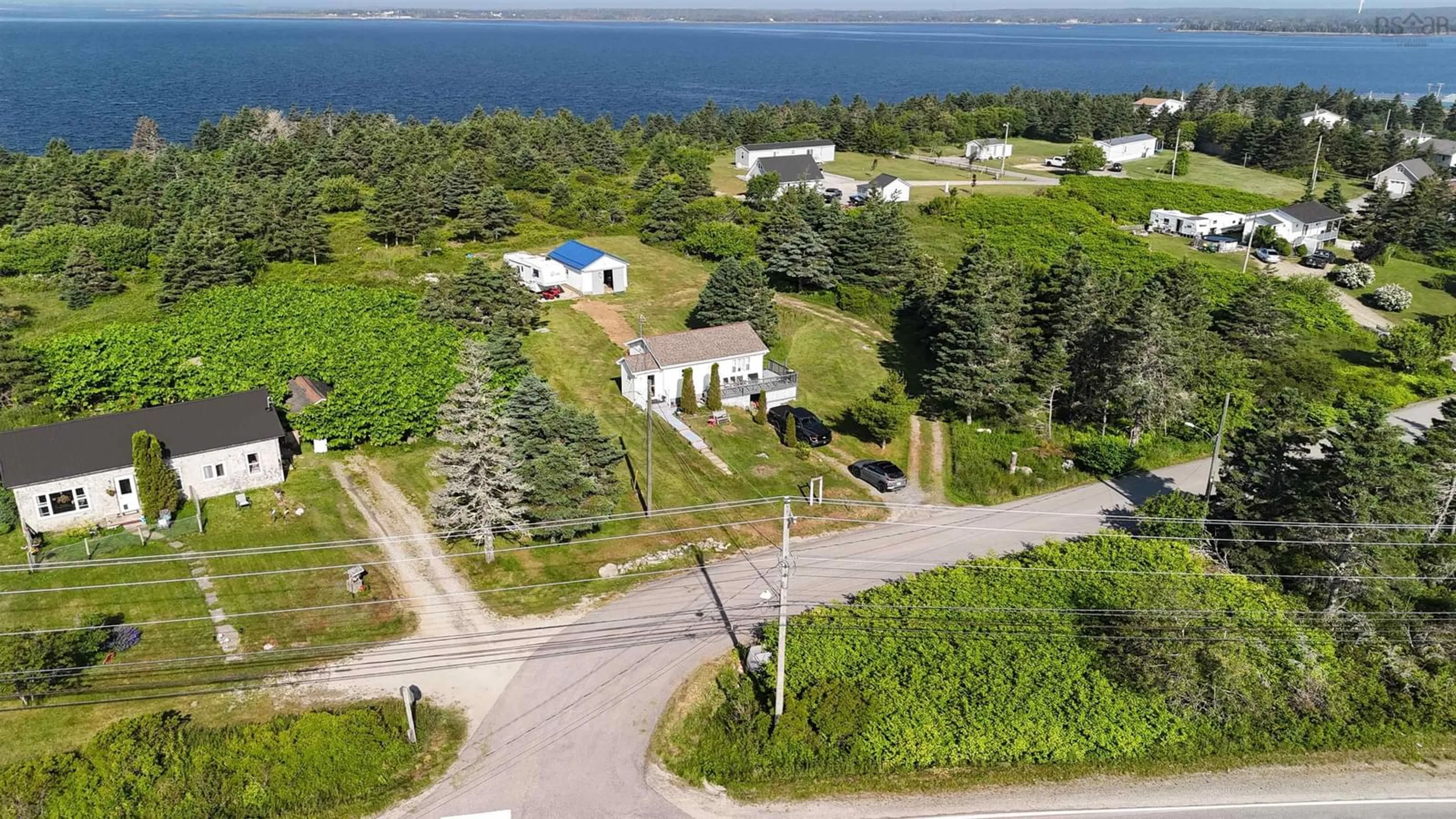 A pic from outside/outdoor area/front of a property/back of a property/a pic from drone, water/lake/river/ocean view for 60 Red Schoolhouse Lane, North East Point Nova Scotia B0W 2P0