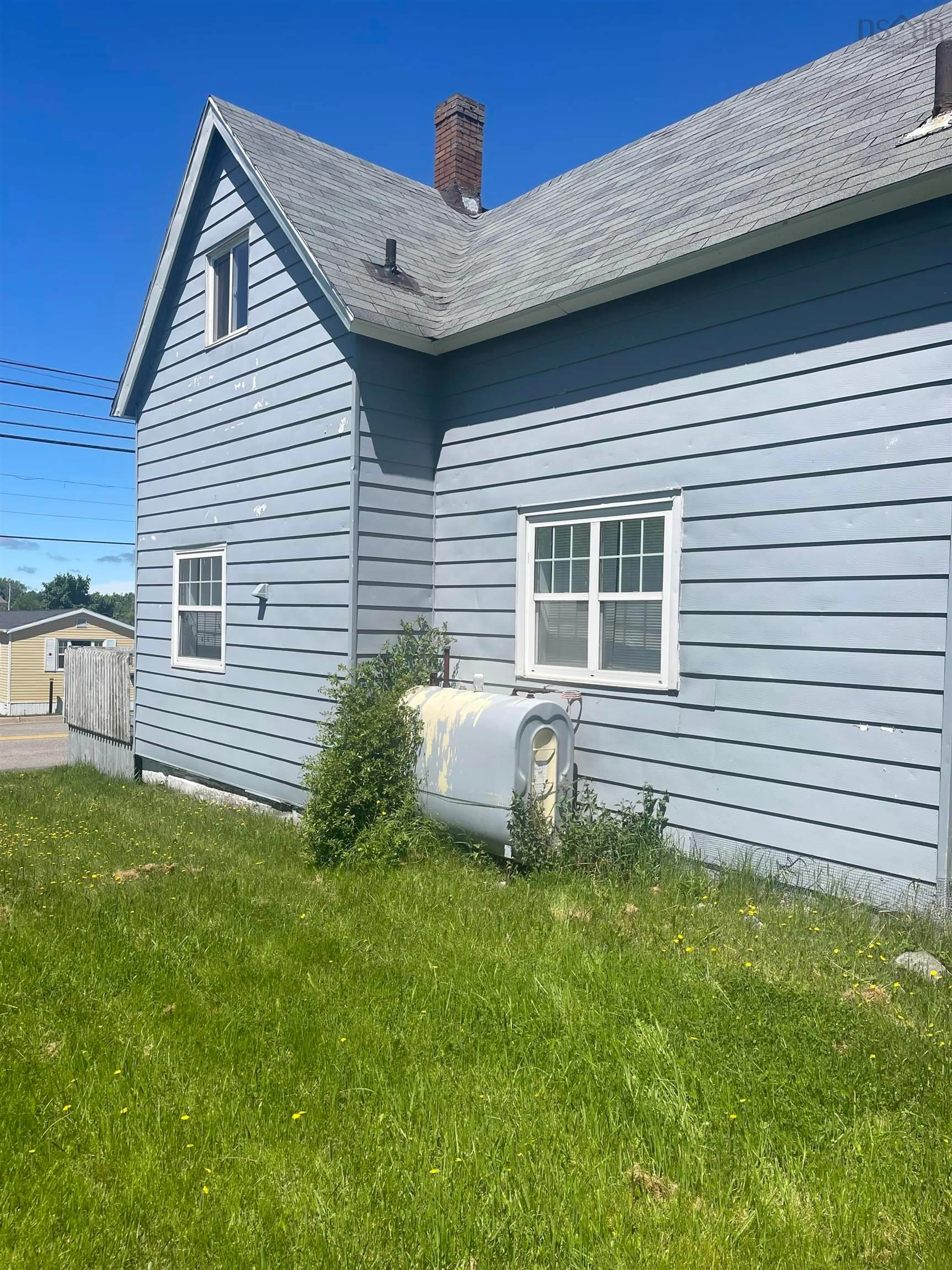 Home with vinyl exterior material, street for 57 Fraser Ave, Sydney Mines Nova Scotia B1V 2C2