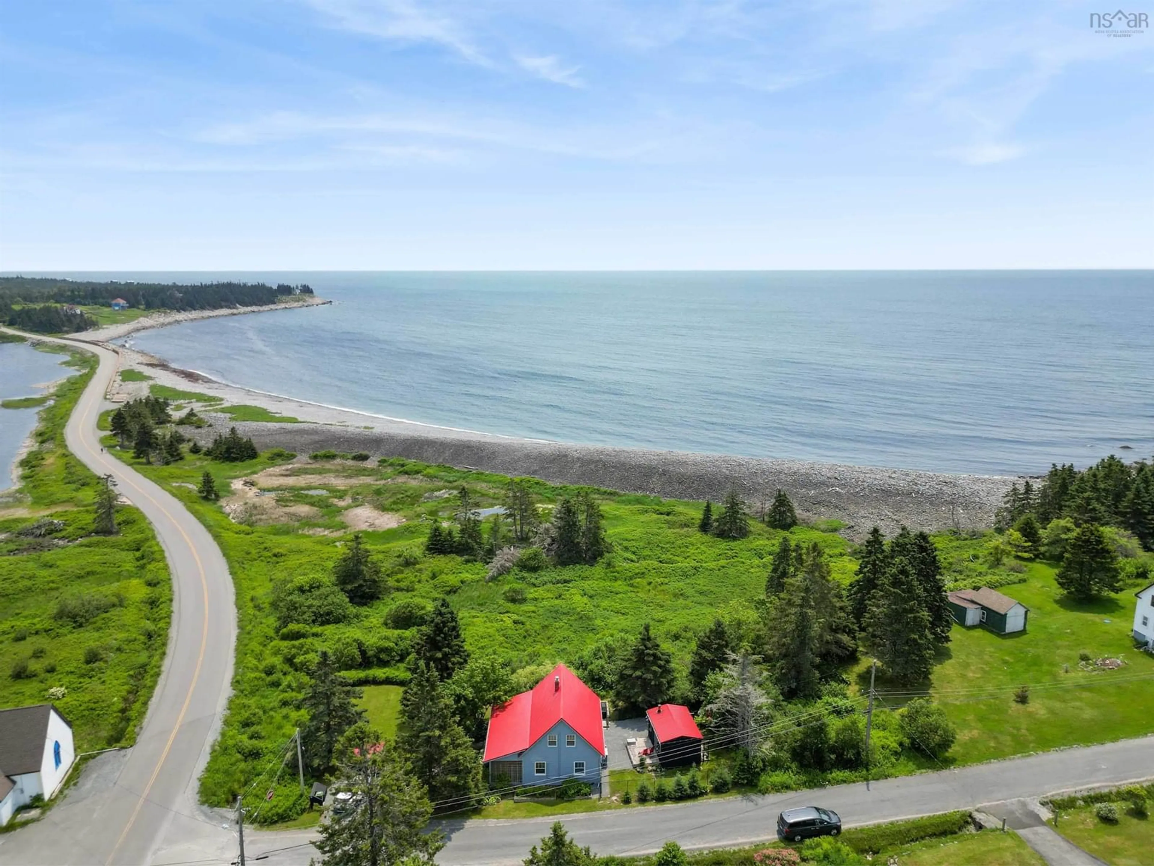 A pic from outside/outdoor area/front of a property/back of a property/a pic from drone, water/lake/river/ocean view for 5 Sand Beach Rd, Western Head Nova Scotia B0T 1K0