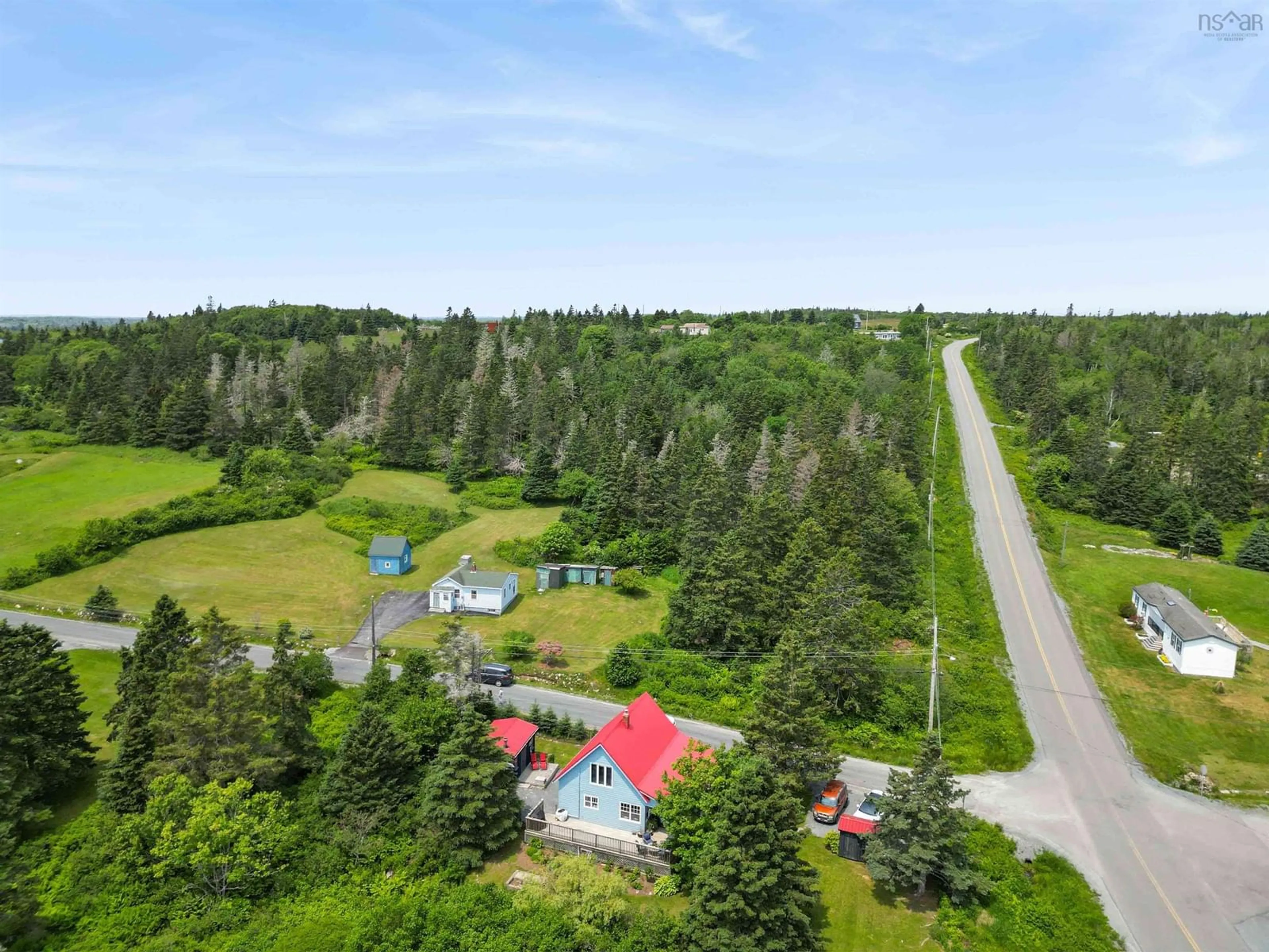 A pic from outside/outdoor area/front of a property/back of a property/a pic from drone, forest/trees view for 5 Sand Beach Rd, Western Head Nova Scotia B0T 1K0