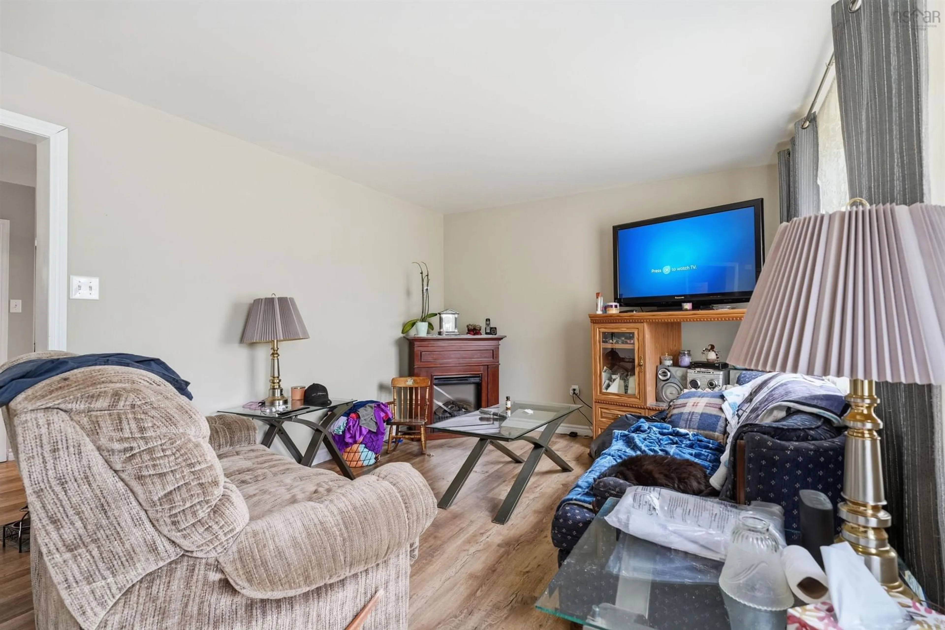 Living room with furniture, wood/laminate floor for 68 Albro Lake Rd, Dartmouth Nova Scotia B3A 3Y3