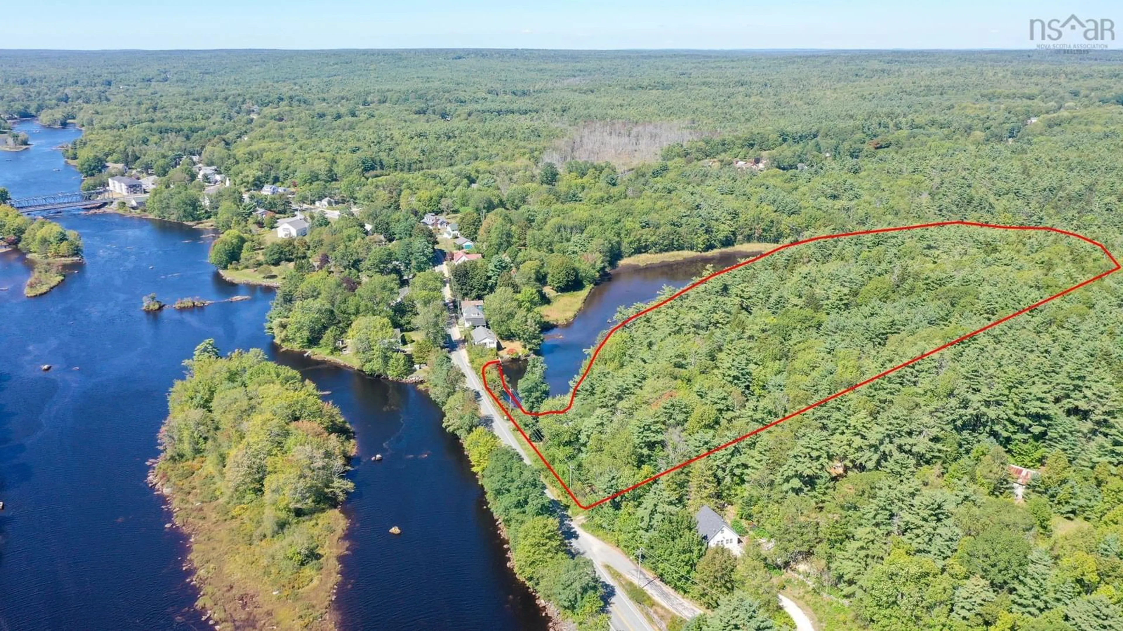A pic from outside/outdoor area/front of a property/back of a property/a pic from drone, water/lake/river/ocean view for 221 Highway 8, Milton Nova Scotia B0T 1P0