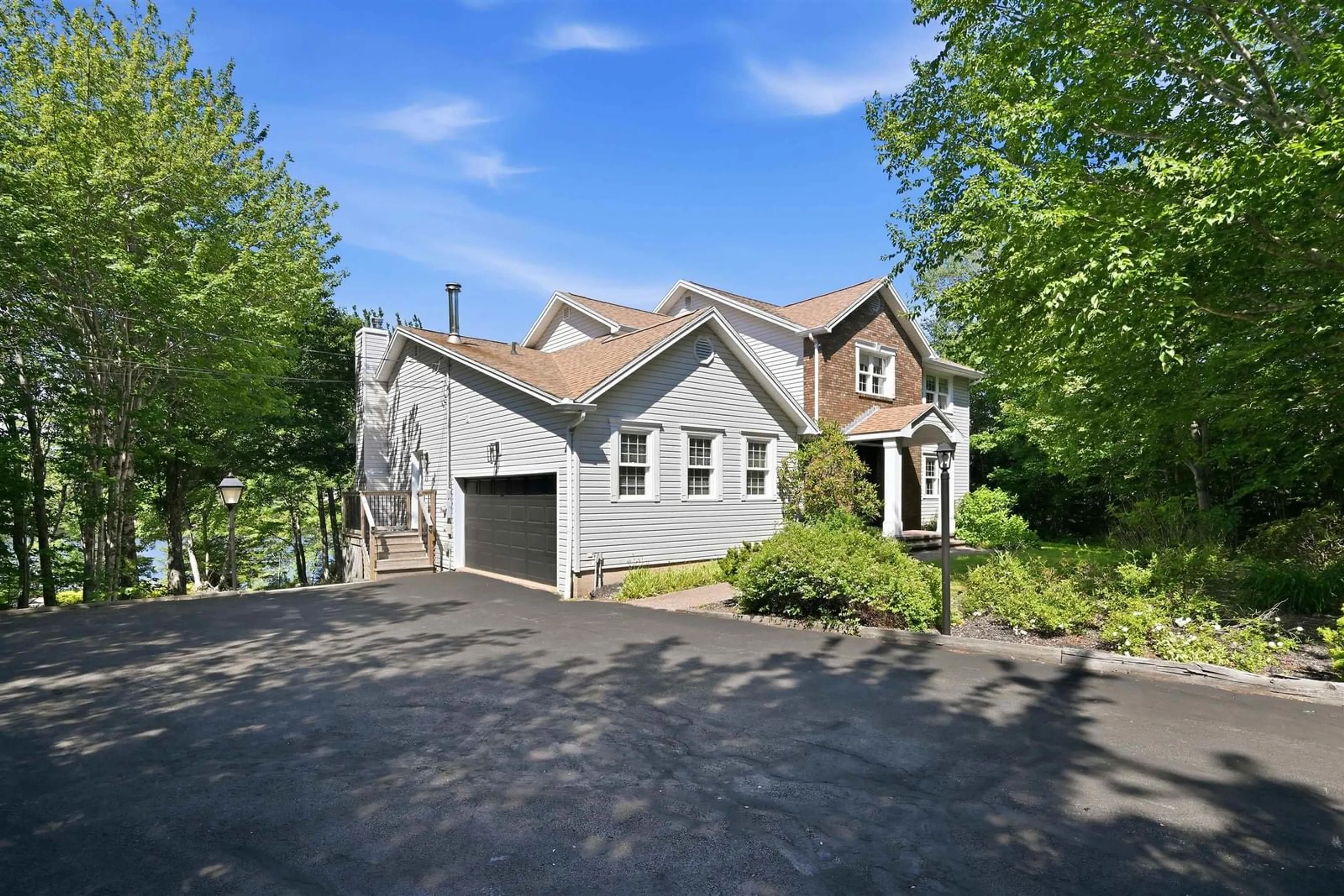 A pic from outside/outdoor area/front of a property/back of a property/a pic from drone, street for 59 Long Lake Dr, Kingswood Nova Scotia B4B 1K6