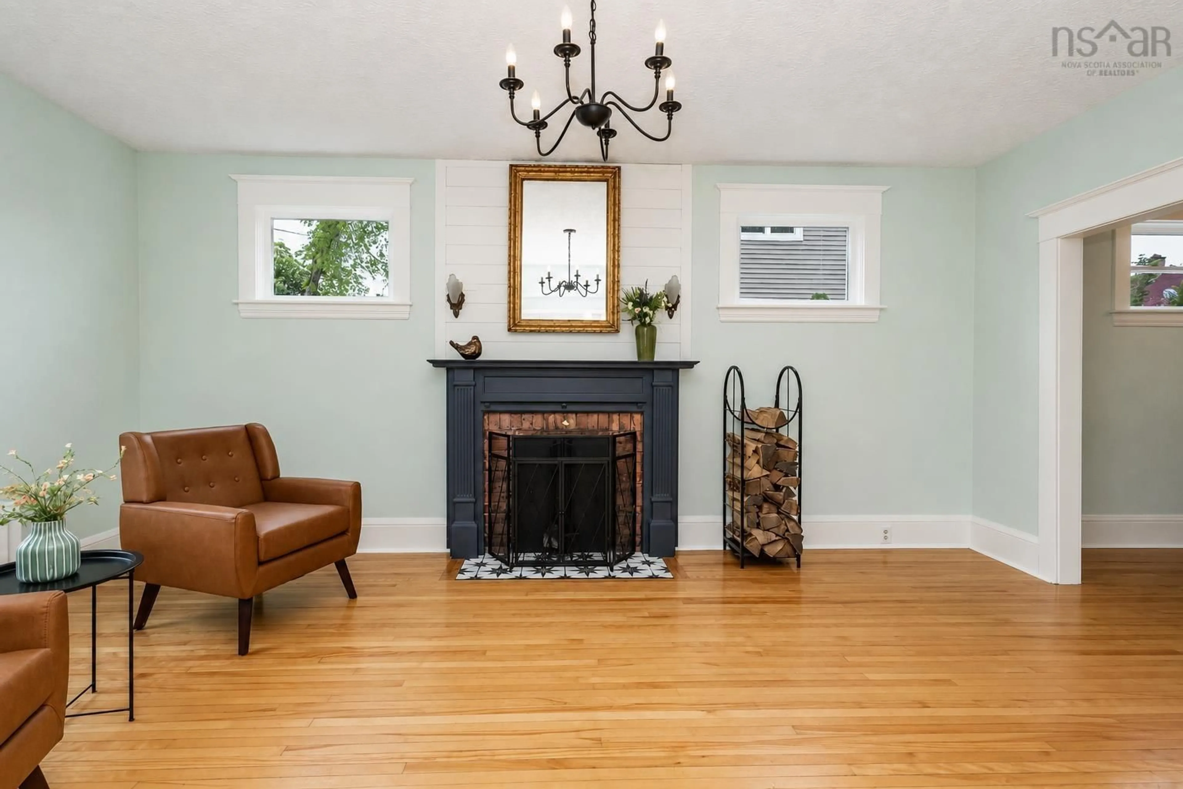 Living room with furniture, wood/laminate floor for 67 Milton St, Sydney Nova Scotia B1P 4L9
