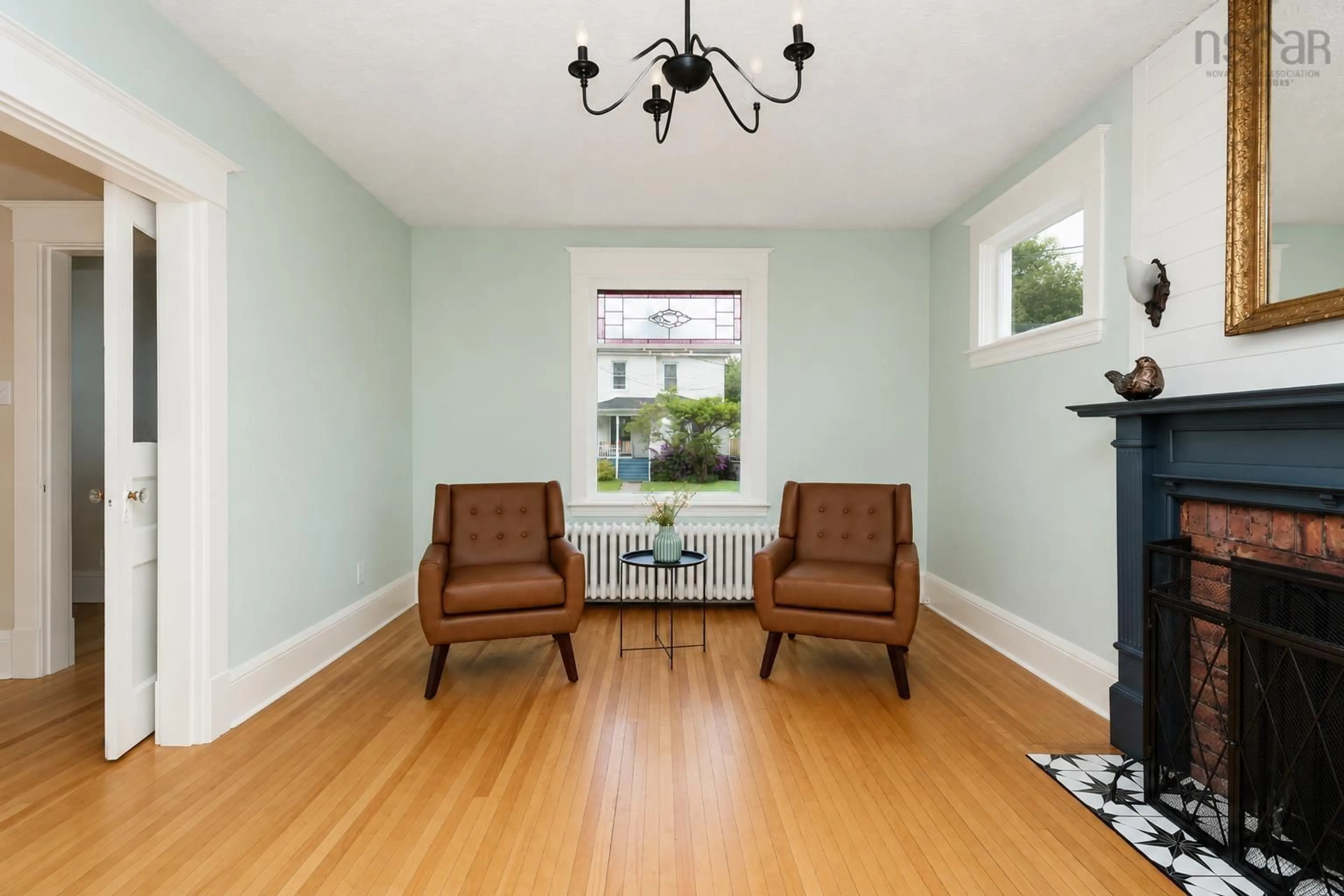 Living room with furniture, wood/laminate floor for 67 Milton St, Sydney Nova Scotia B1P 4L9