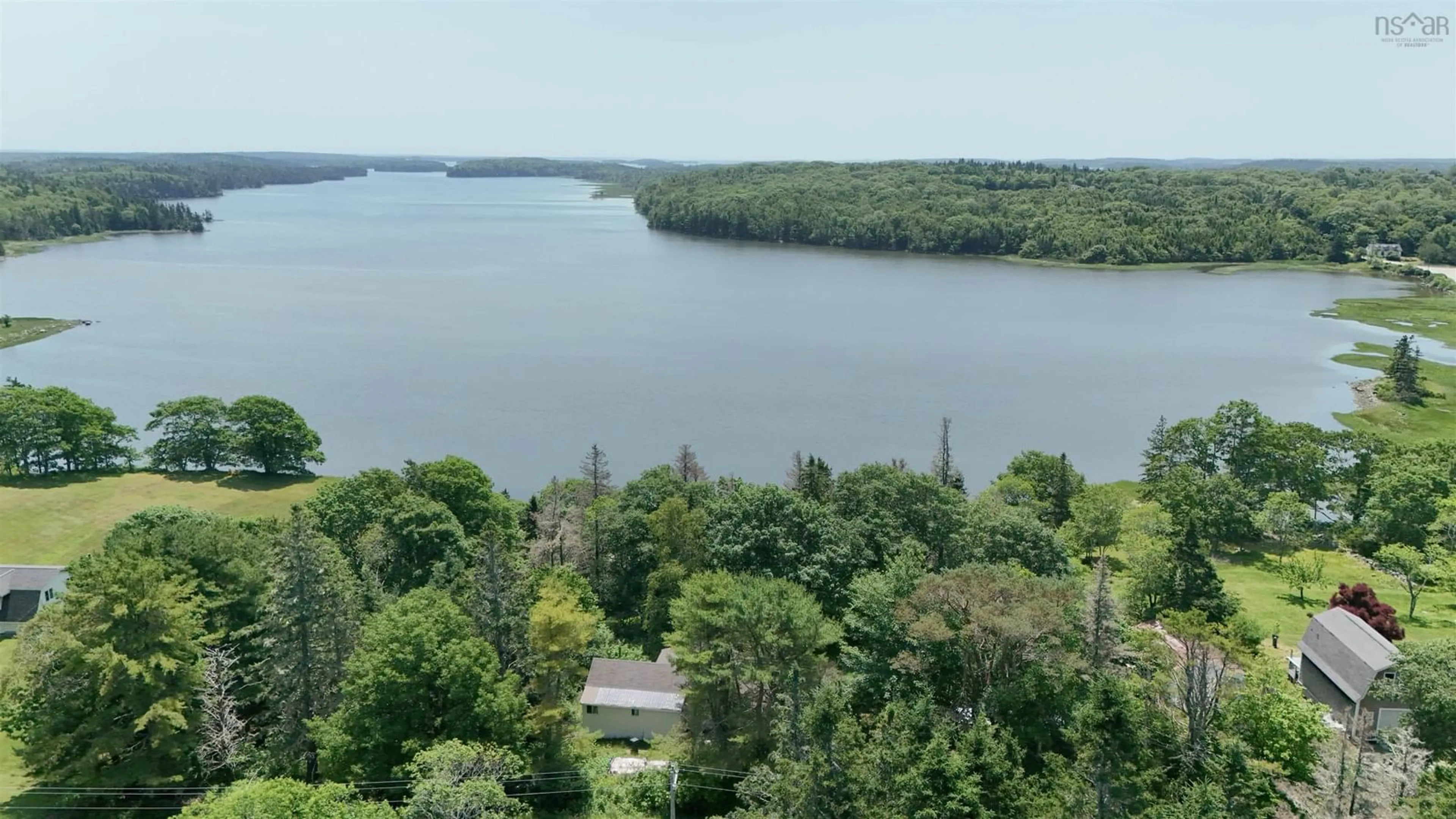 A pic from outside/outdoor area/front of a property/back of a property/a pic from drone, water/lake/river/ocean view for 5881 Highway 3, Glenwood Nova Scotia B0W 1W0