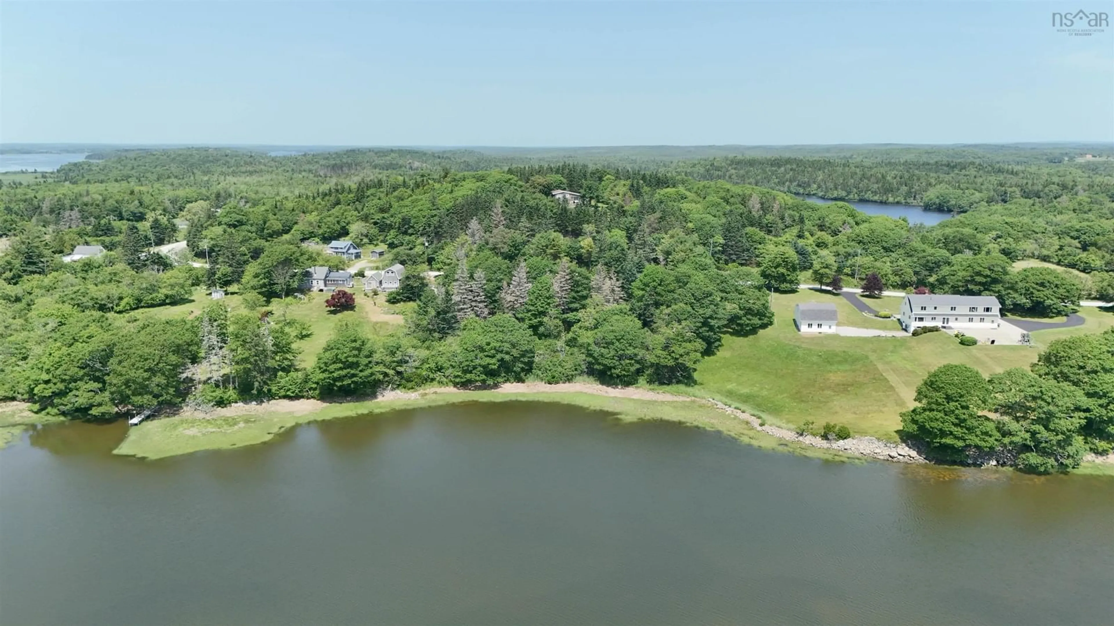 A pic from outside/outdoor area/front of a property/back of a property/a pic from drone, water/lake/river/ocean view for 5881 Highway 3, Glenwood Nova Scotia B0W 1W0