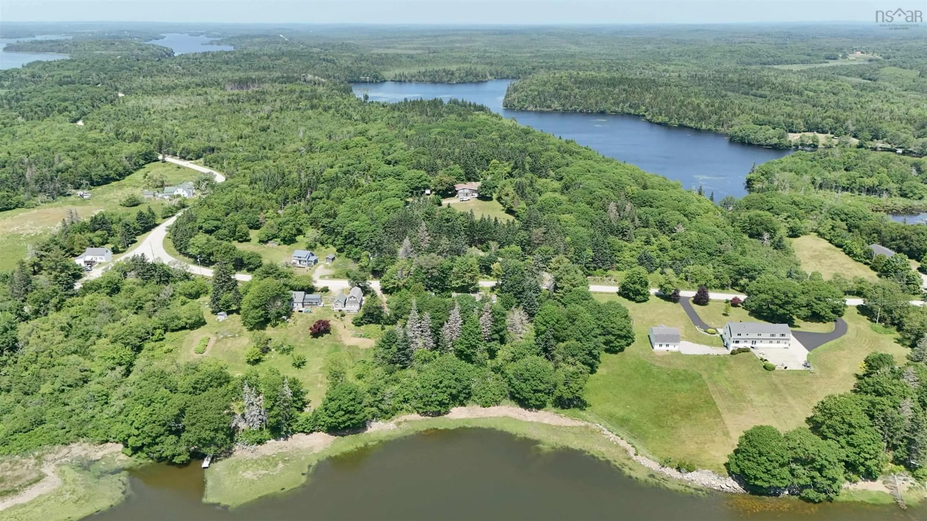 A pic from outside/outdoor area/front of a property/back of a property/a pic from drone, water/lake/river/ocean view for 5881 Highway 3, Glenwood Nova Scotia B0W 1W0