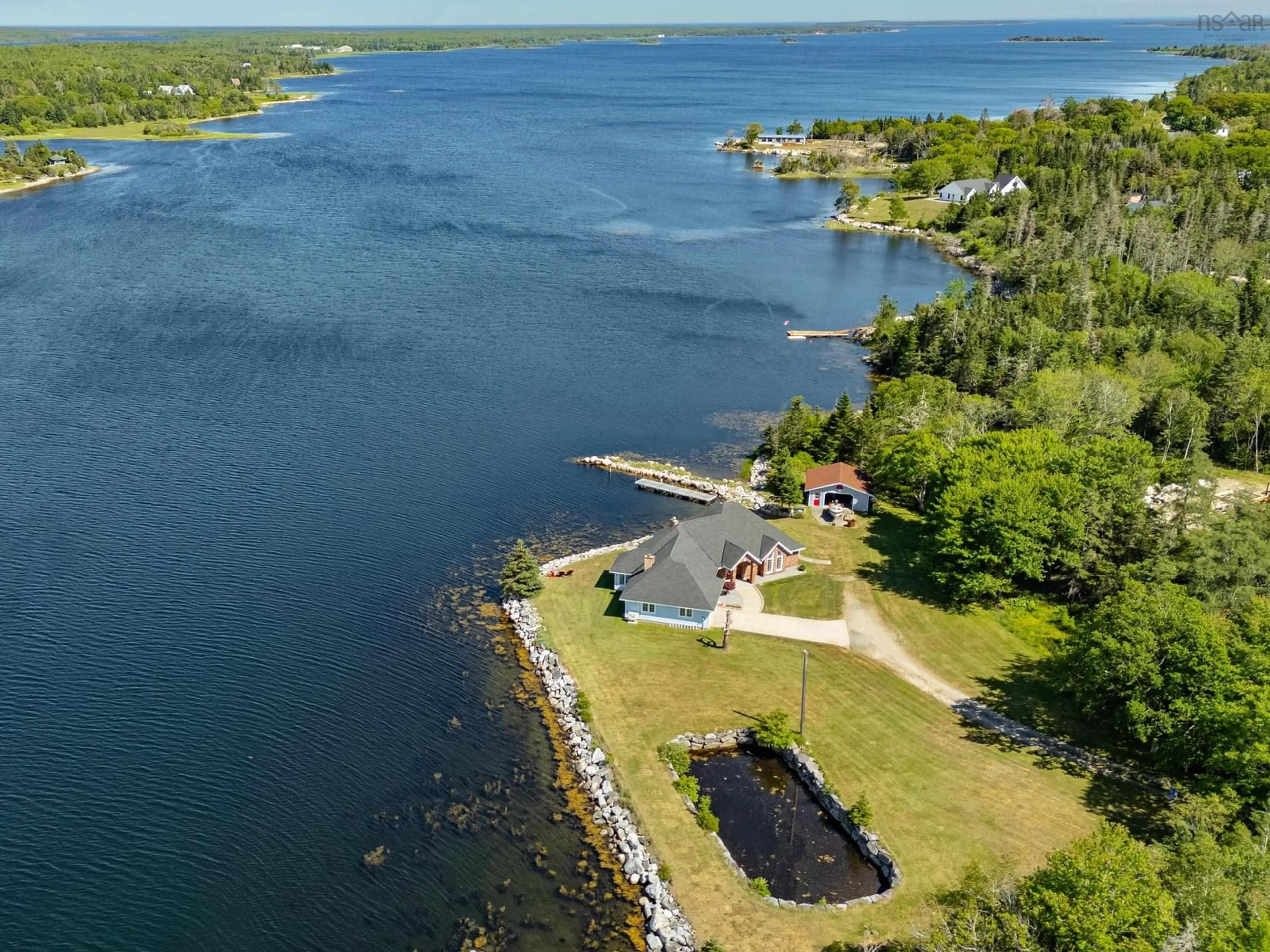 A pic from outside/outdoor area/front of a property/back of a property/a pic from drone, water/lake/river/ocean view for 195 Port Latour Rd, Port Clyde Nova Scotia B0W 2S0