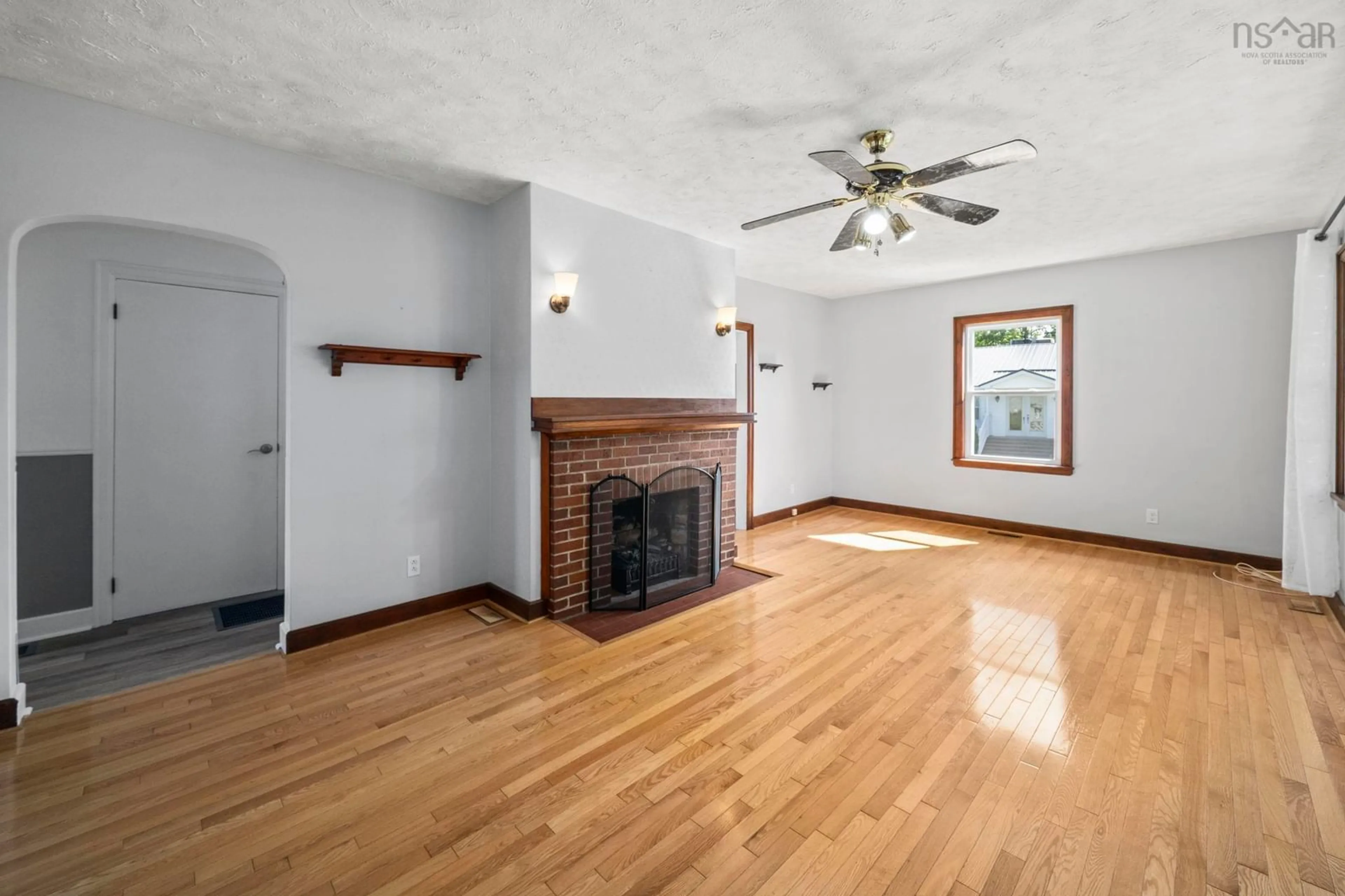 Living room with furniture, wood/laminate floor for 7793 Highway 7, Musquodoboit Harbour Nova Scotia B0J 2L0