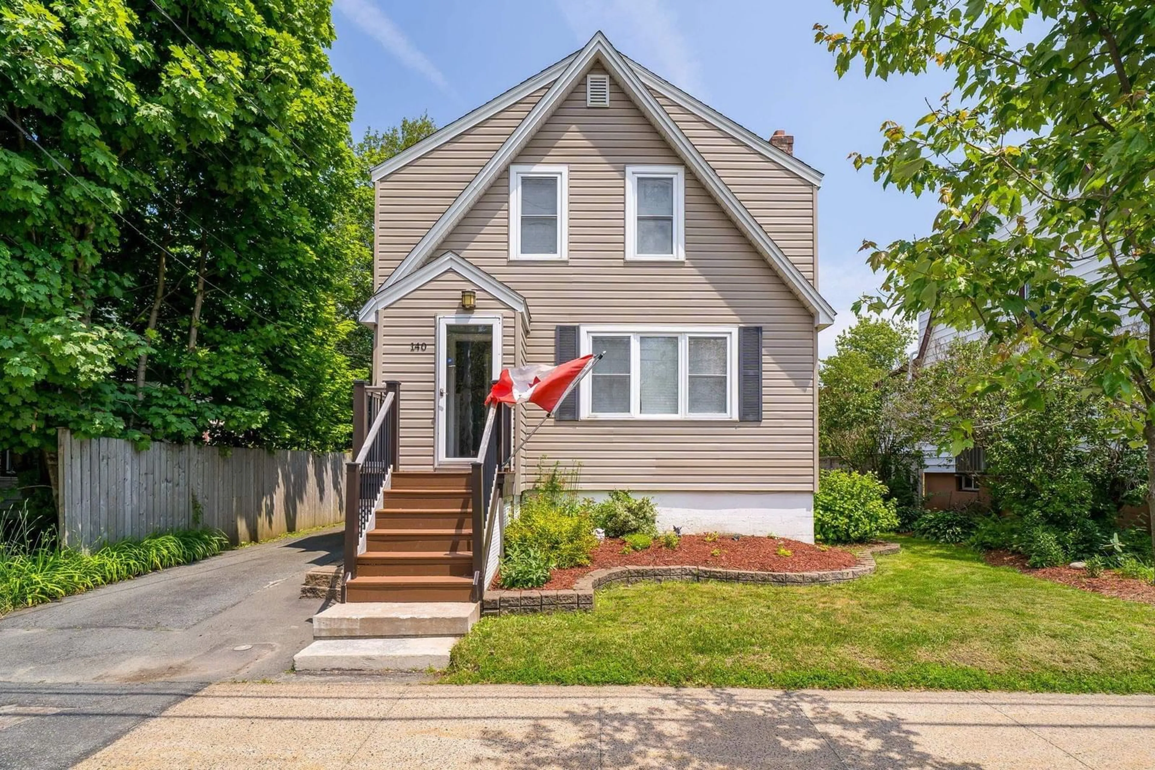 Home with vinyl exterior material, street for 140 Victoria Rd, Dartmouth Nova Scotia B3A 1V7