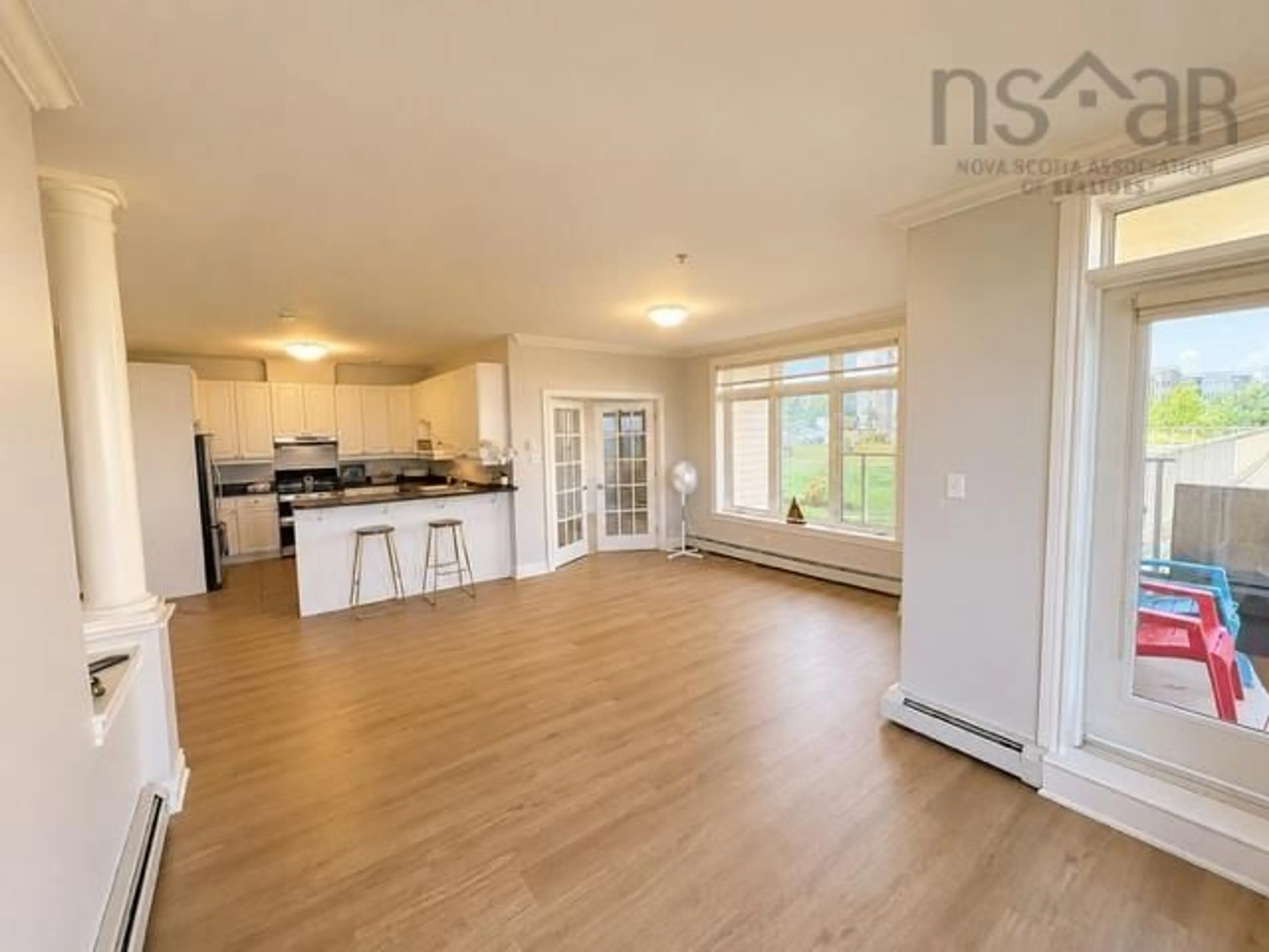 Open concept kitchen, wood/laminate floor for 53 Bedros Lane #104, Halifax Nova Scotia B3M 4X4