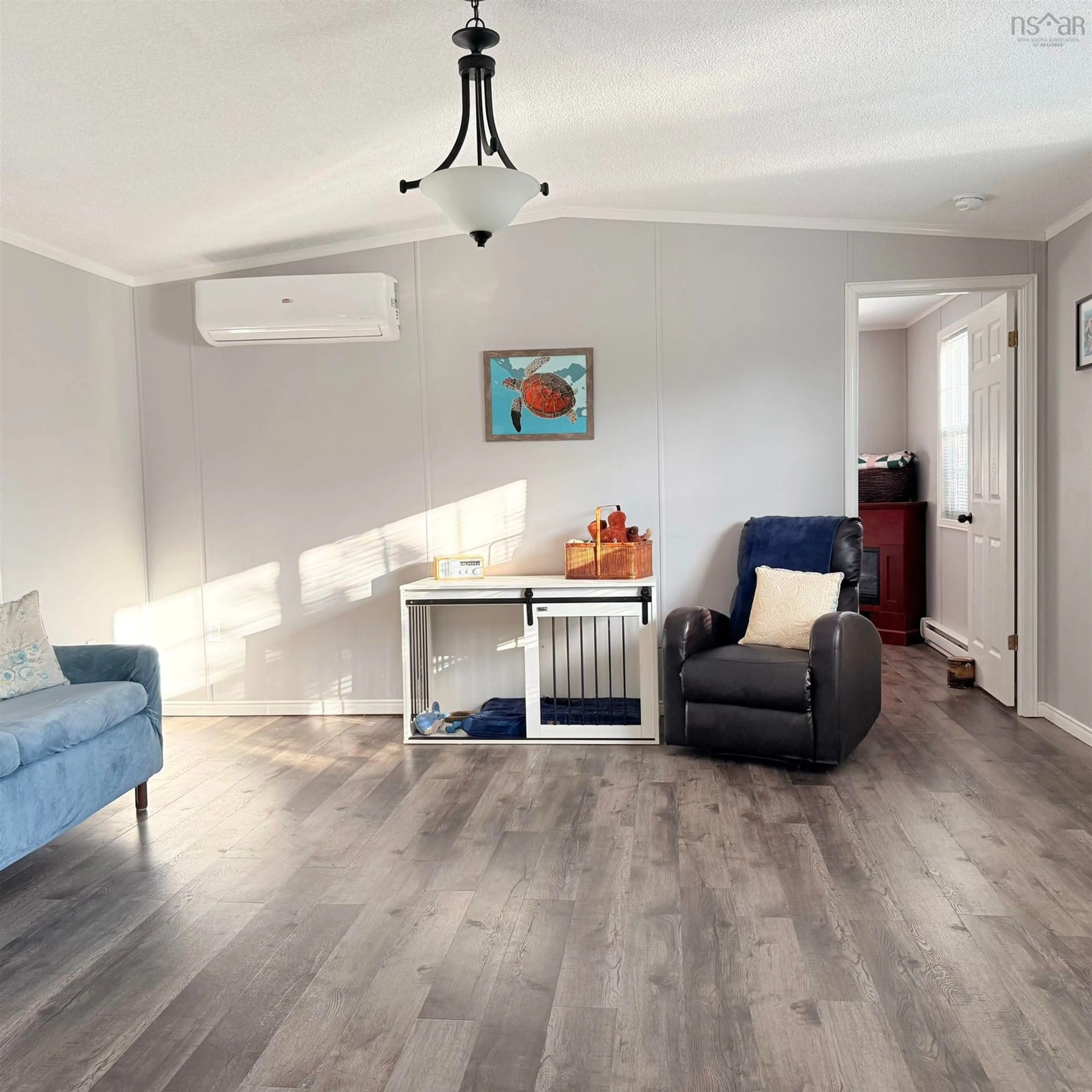 Living room with furniture, wood/laminate floor for 533 Young St, Truro Nova Scotia B2N 3Y8