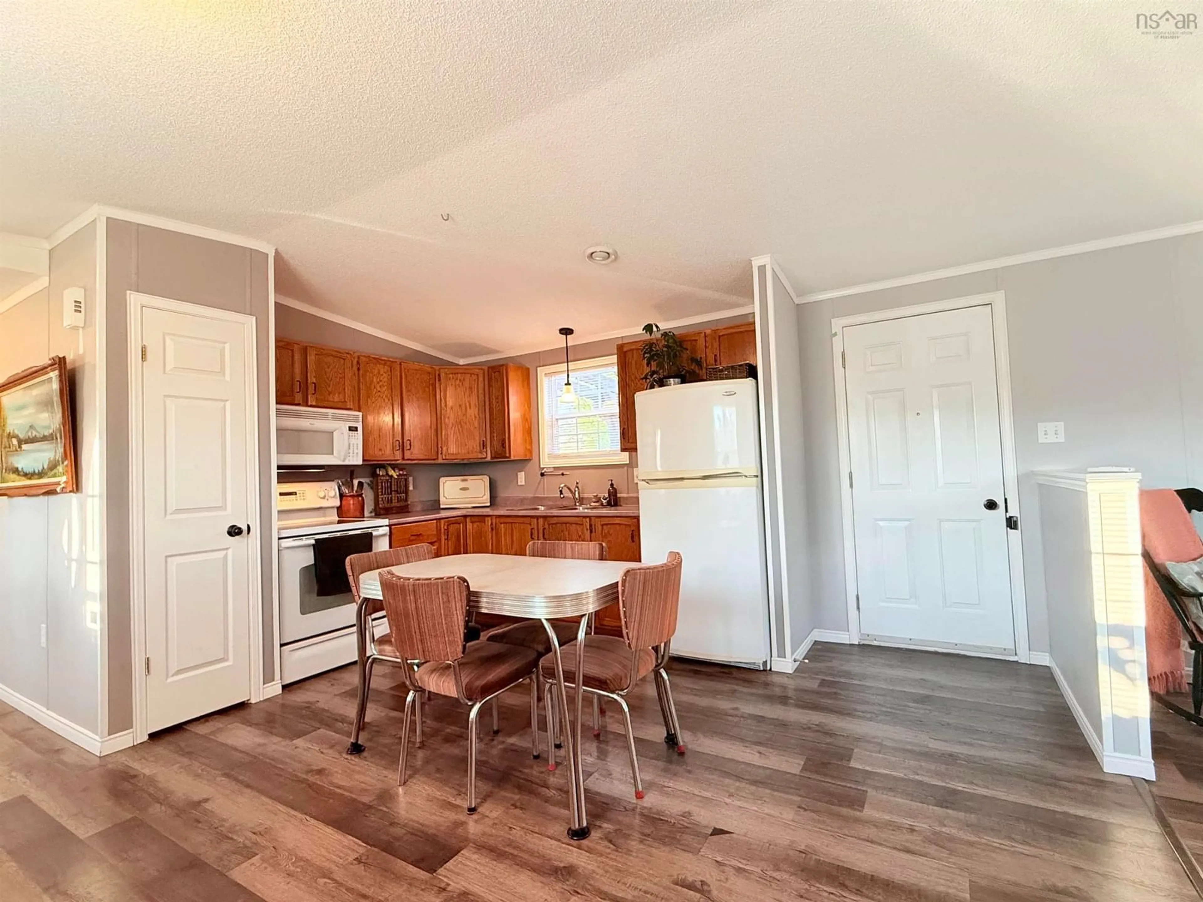 Open concept kitchen, wood/laminate floor for 533 Young St, Truro Nova Scotia B2N 3Y8
