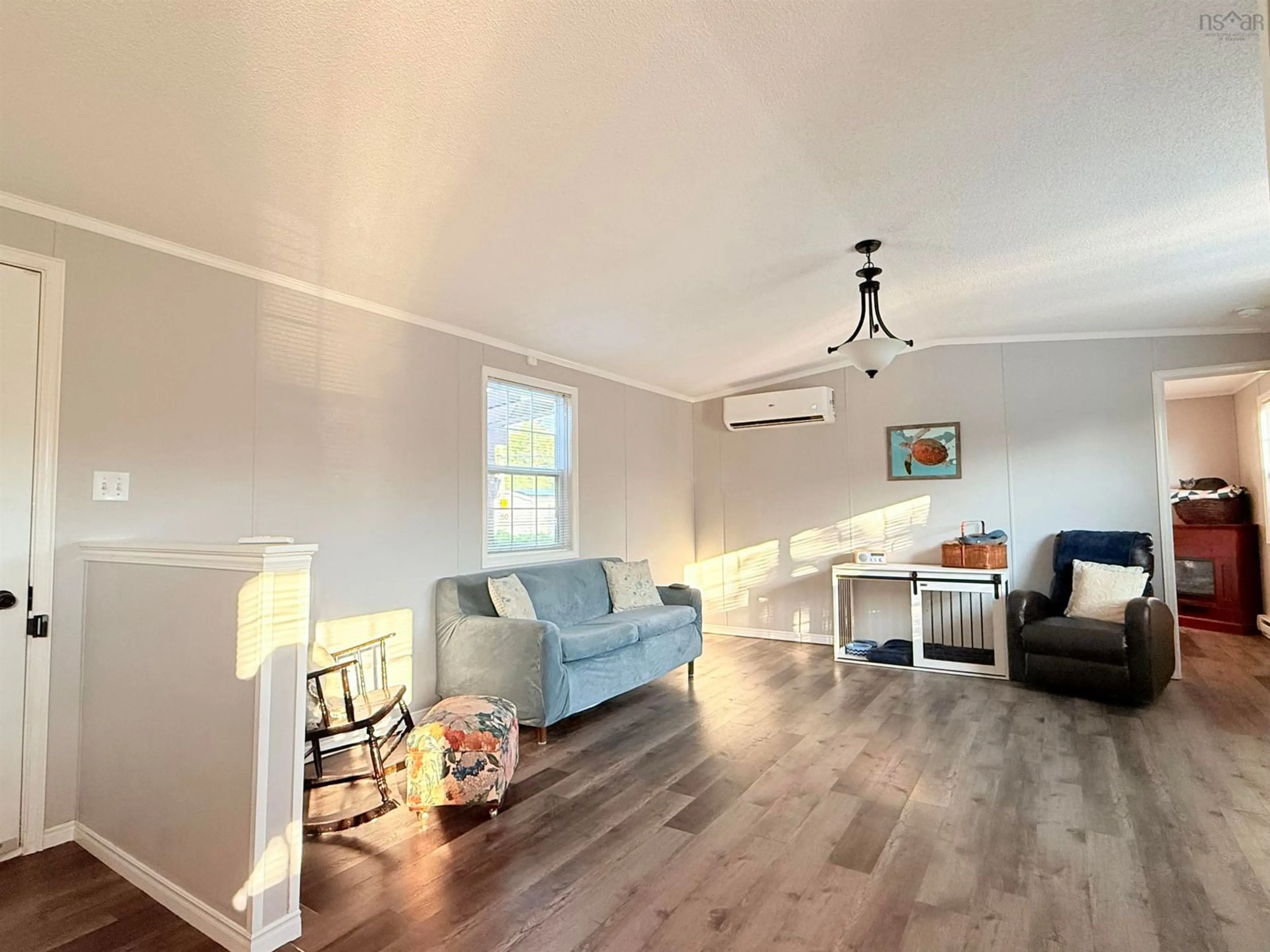 Living room with furniture, wood/laminate floor for 533 Young St, Truro Nova Scotia B2N 3Y8