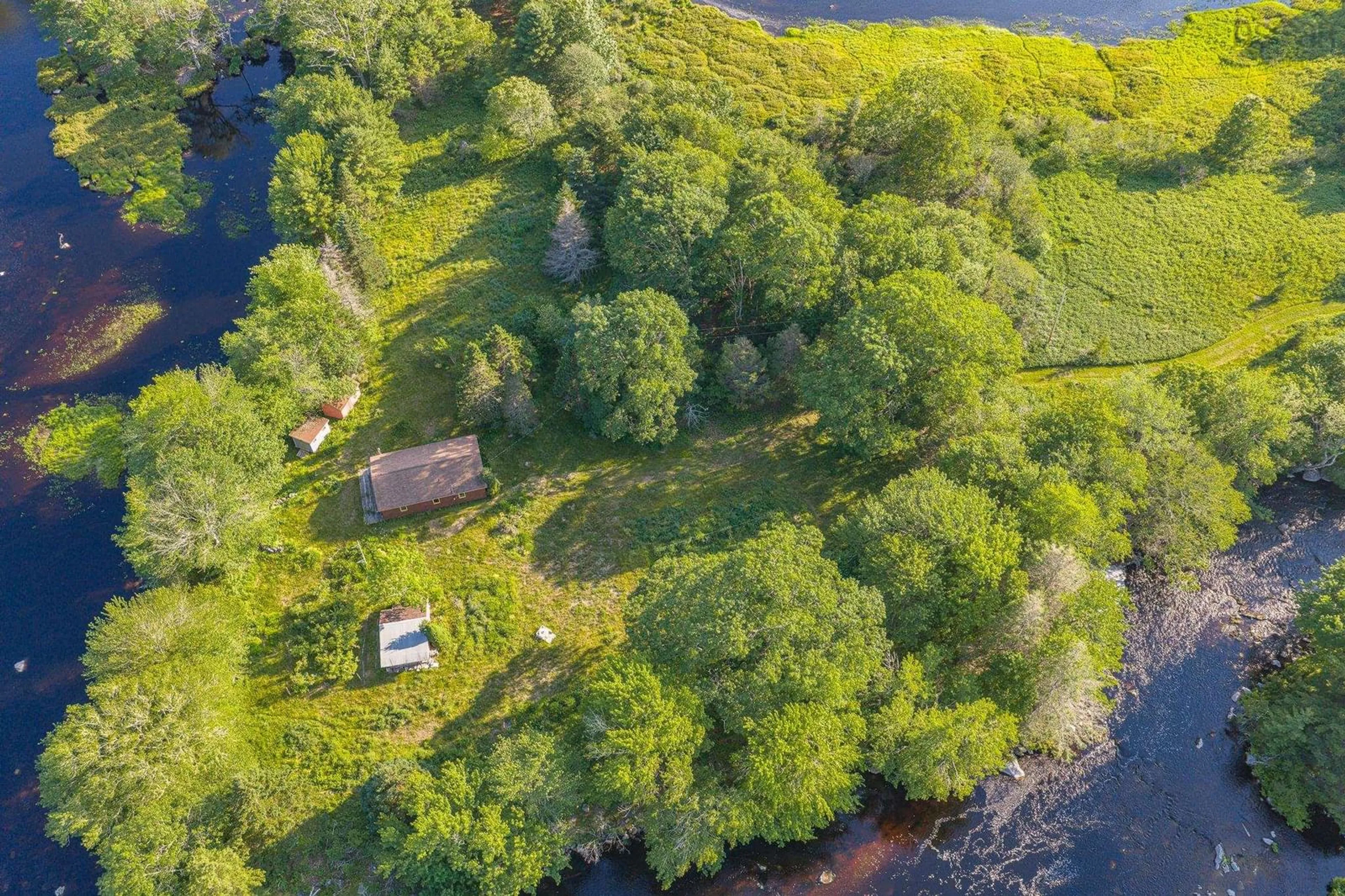 A pic from outside/outdoor area/front of a property/back of a property/a pic from drone, water/lake/river/ocean view for 40 Mcgillis Island, Middle Ohio Nova Scotia B0T 1W0