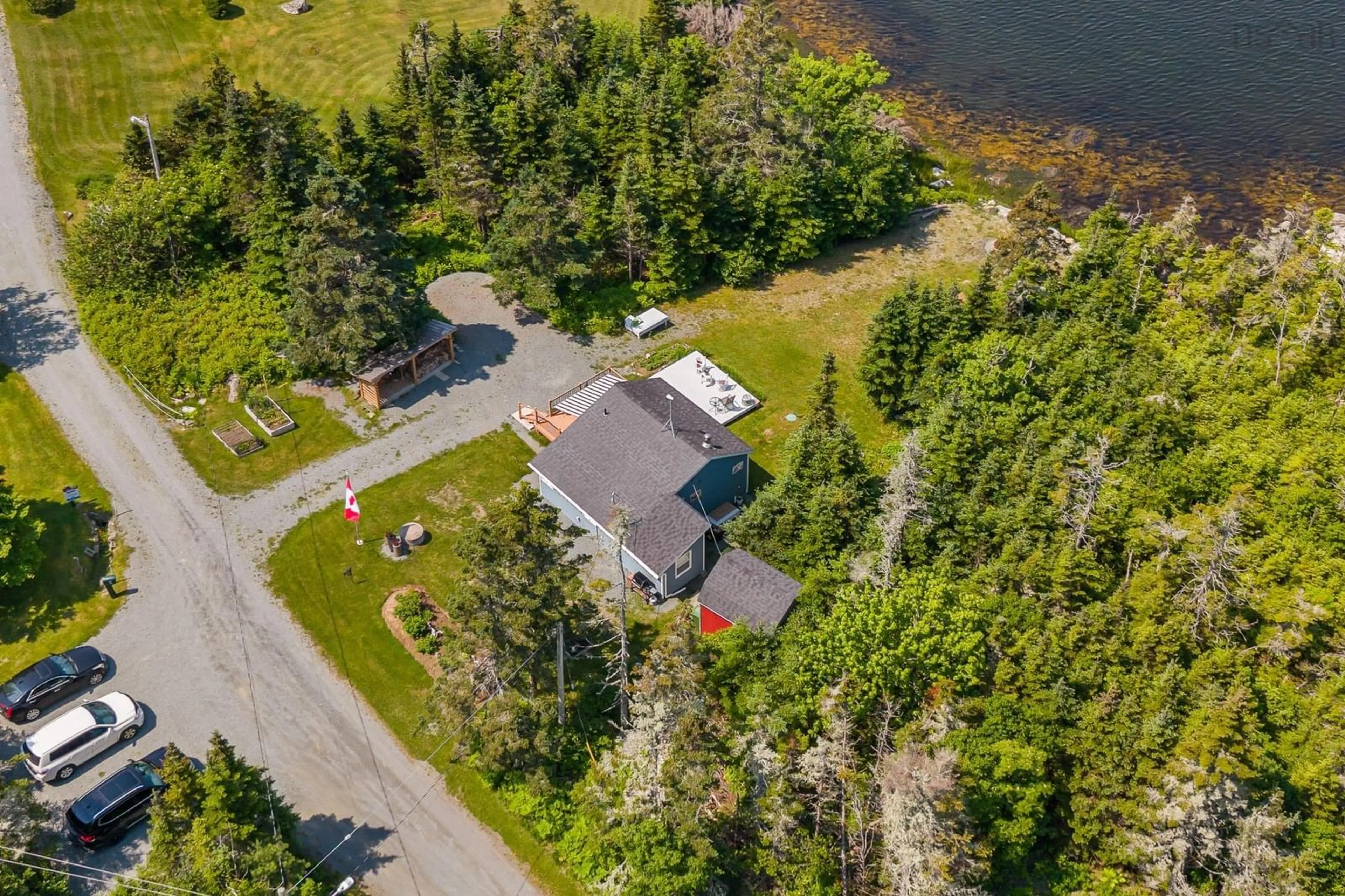 A pic from outside/outdoor area/front of a property/back of a property/a pic from drone, water/lake/river/ocean view for 120 Power Rd, Tangier Nova Scotia B0J 3H0