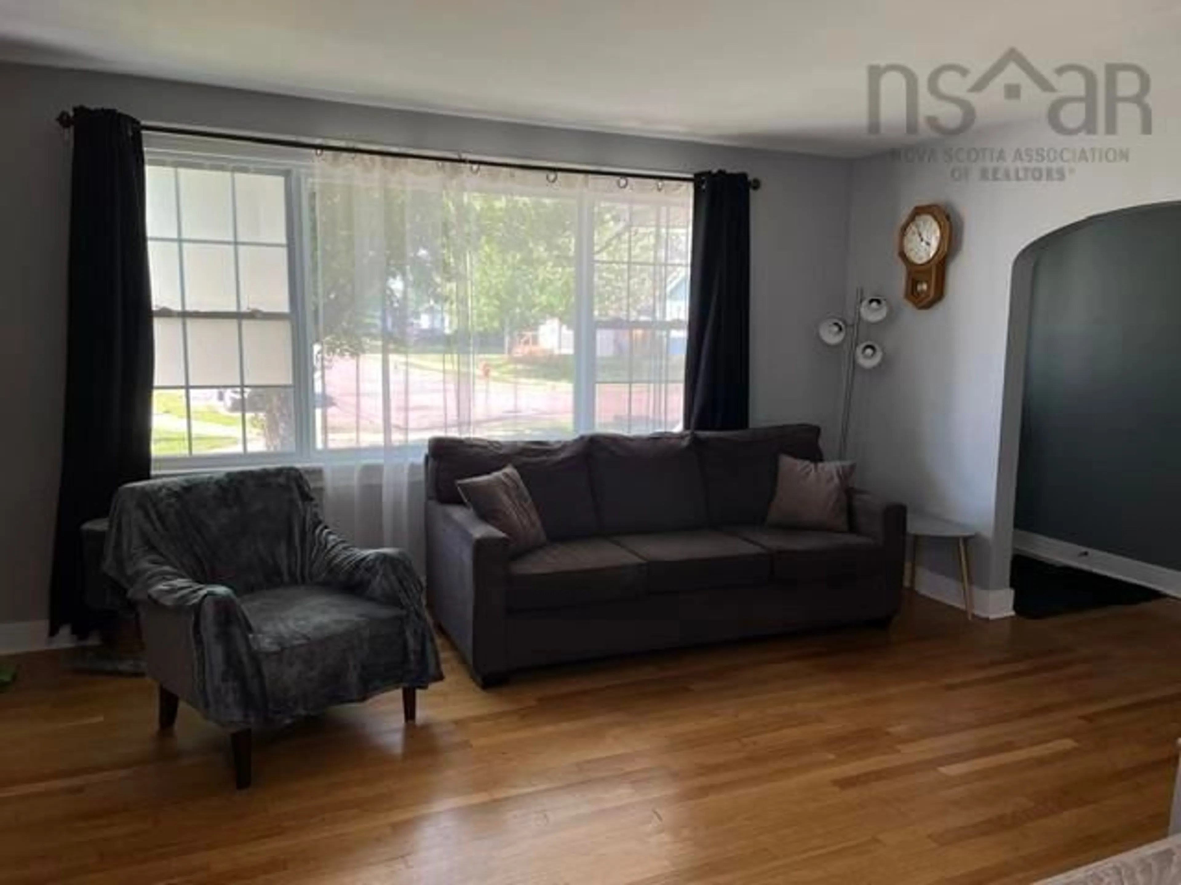 Living room with furniture, wood/laminate floor for 26 Crescent Dr, Truro Nova Scotia B2N 1N6