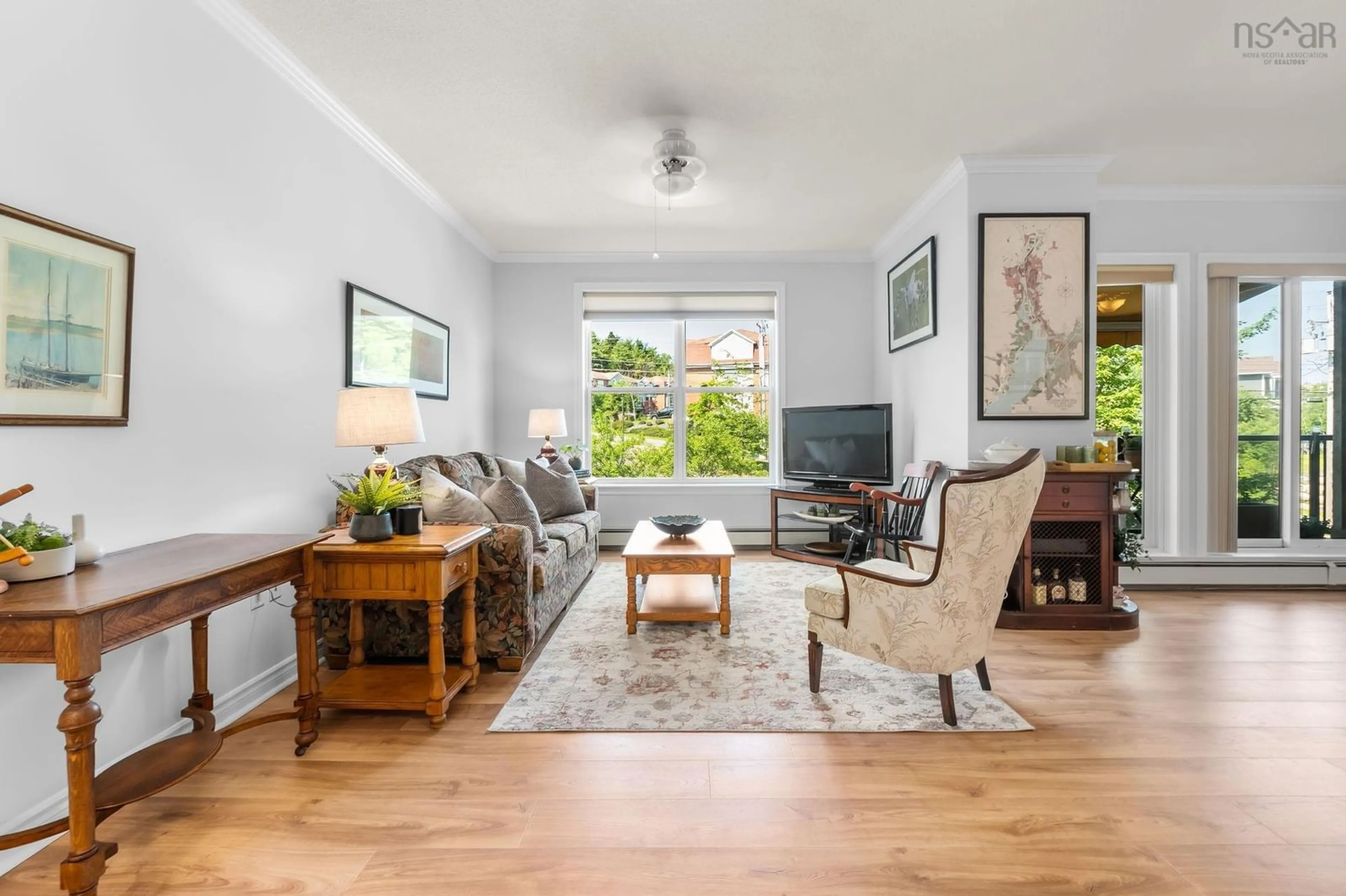 Living room with furniture, wood/laminate floor for 120 Southgate Dr #213, Bedford Nova Scotia B4A 0B1