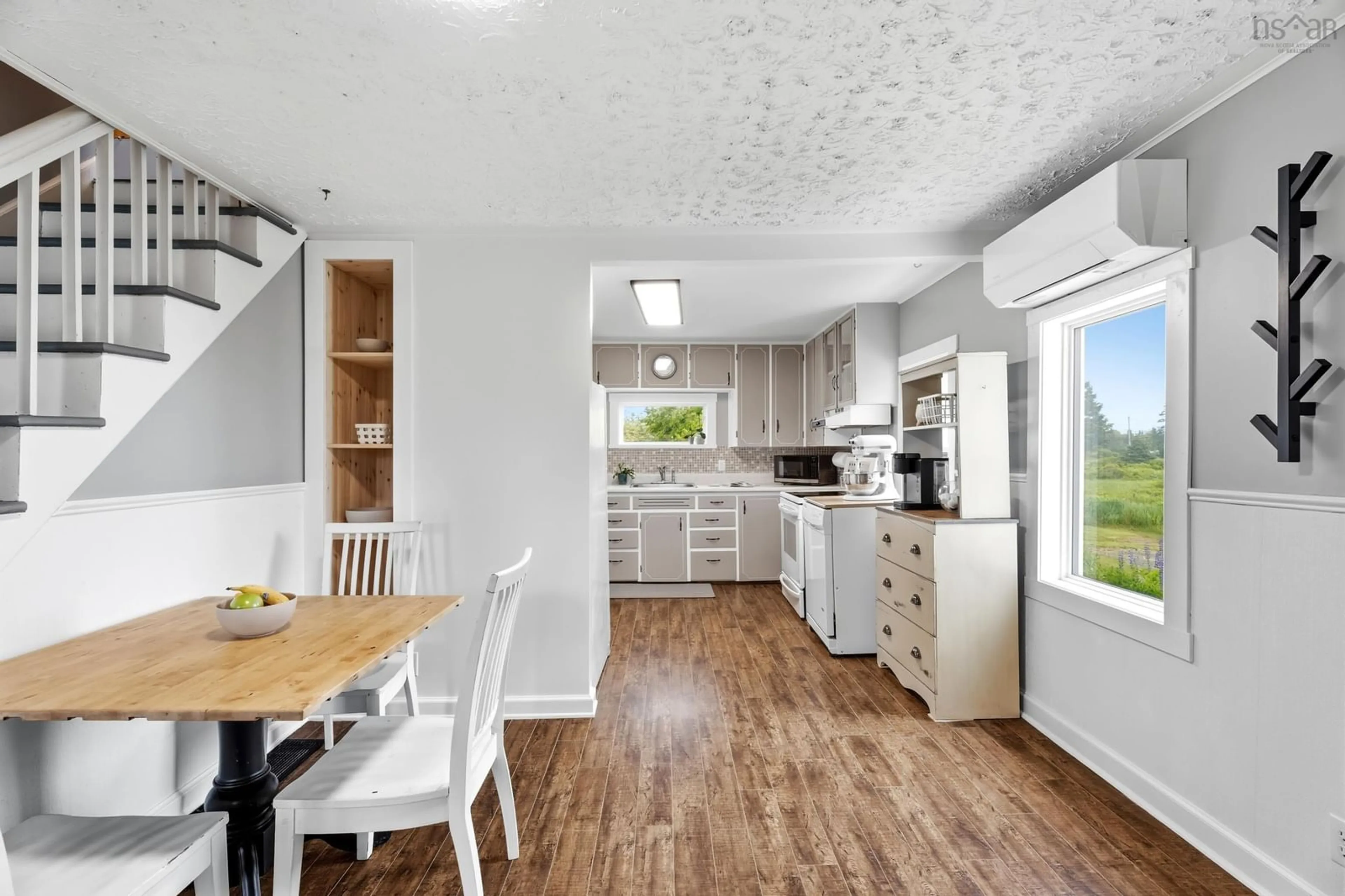 Open concept kitchen, wood/laminate floor for 1729 Ketch Harbour Rd, Sambro Nova Scotia B3V 1L6