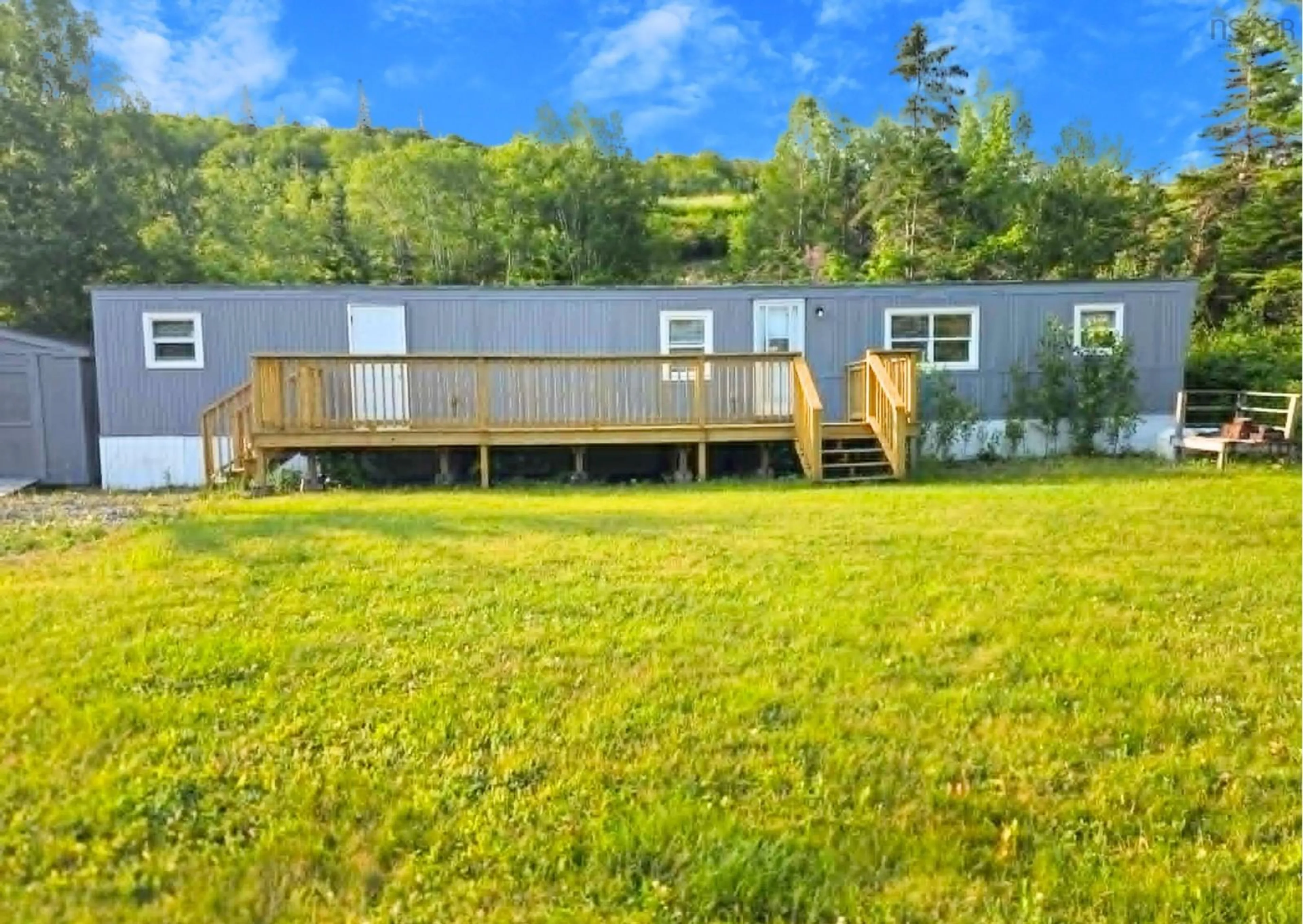 A pic from outside/outdoor area/front of a property/back of a property/a pic from drone, water/lake/river/ocean view for 5 Penny Lane, Big Pond Nova Scotia B1J 1R9