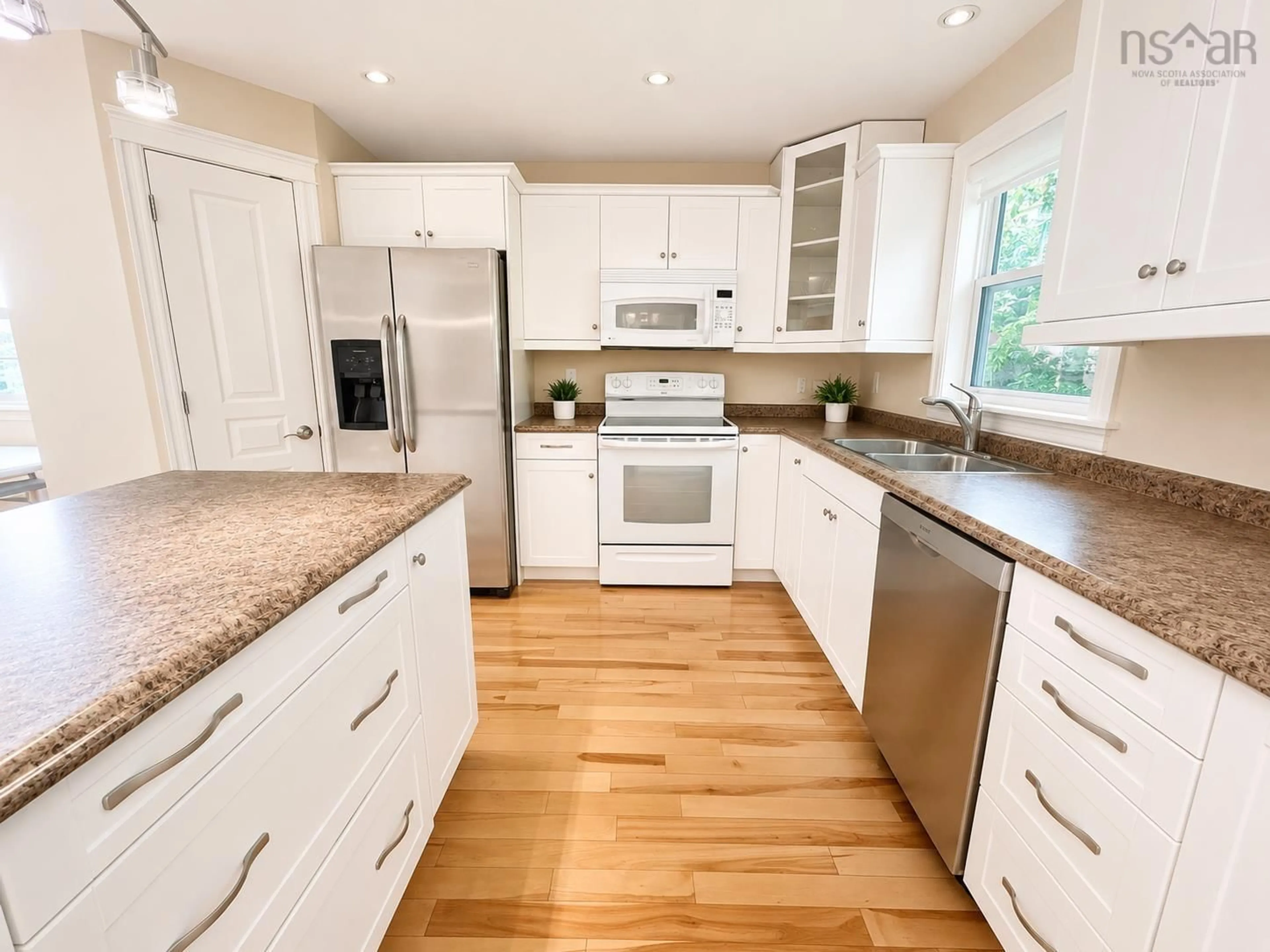 Open concept kitchen, wood/laminate floor for 31 Sagewood Lane, Halifax Nova Scotia B3P 0B8