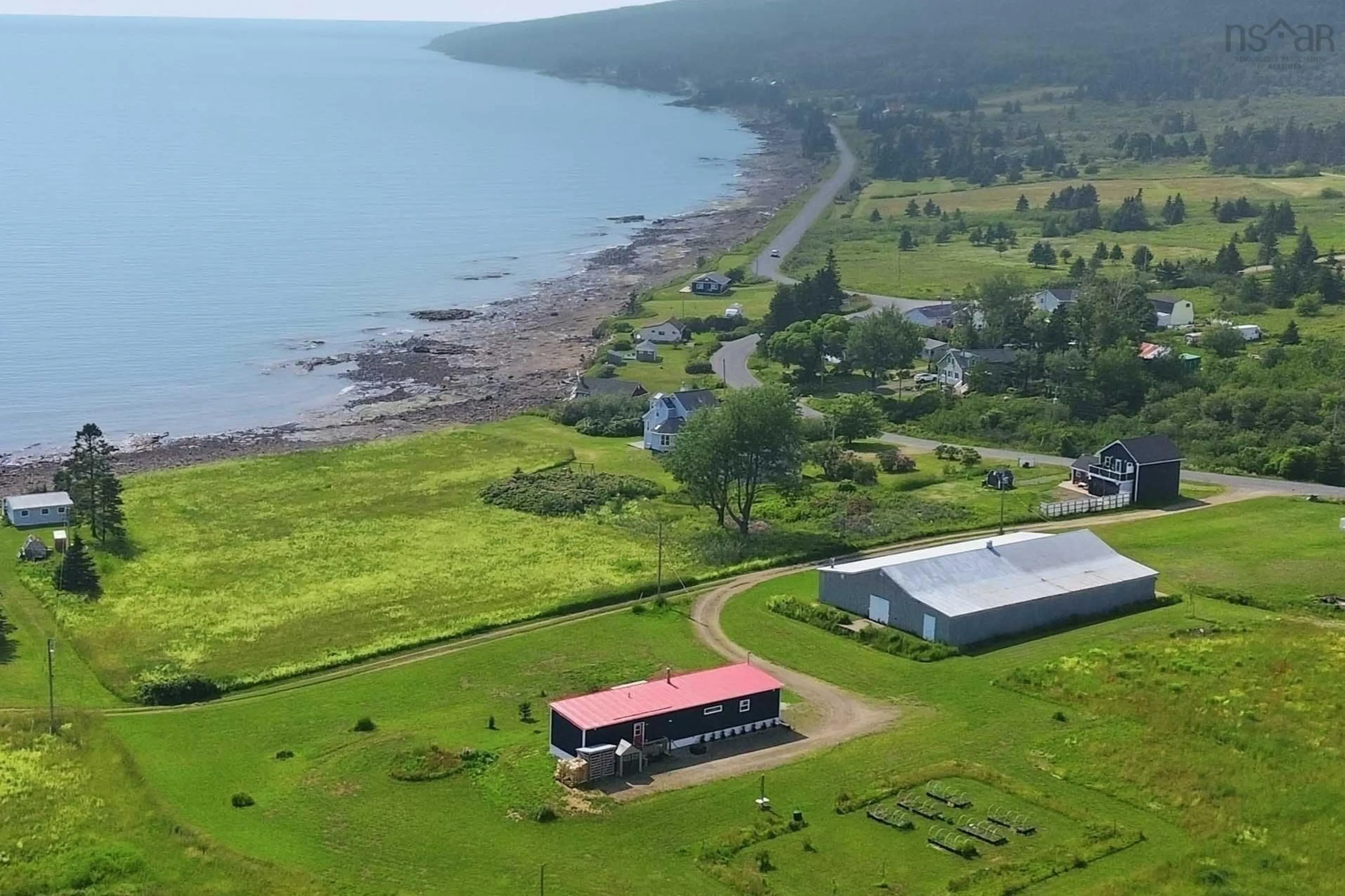 A pic from outside/outdoor area/front of a property/back of a property/a pic from drone, water/lake/river/ocean view for 1474 Cape Split Rd, Scots Bay Nova Scotia B0P 1H0