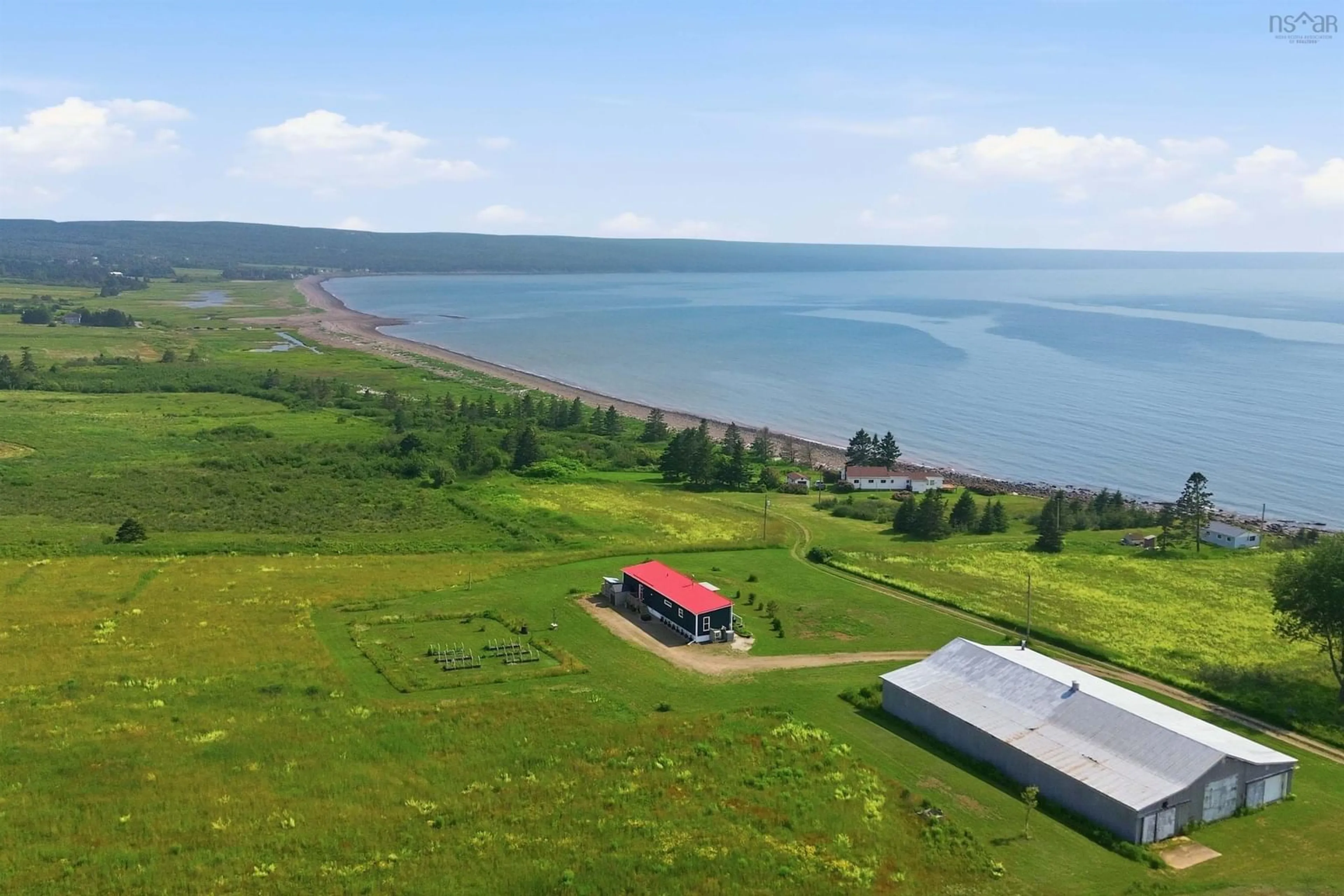 A pic from outside/outdoor area/front of a property/back of a property/a pic from drone, water/lake/river/ocean view for 1474 Cape Split Rd, Scots Bay Nova Scotia B0P 1H0