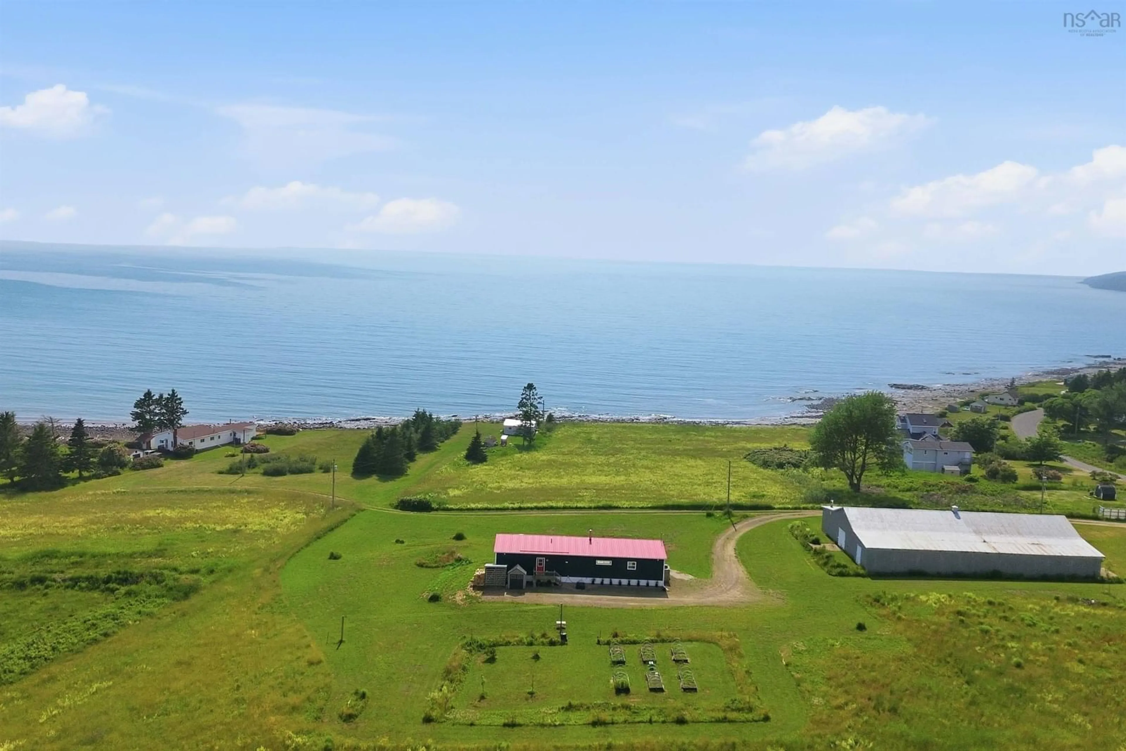 A pic from outside/outdoor area/front of a property/back of a property/a pic from drone, water/lake/river/ocean view for 1474 Cape Split Rd, Scots Bay Nova Scotia B0P 1H0