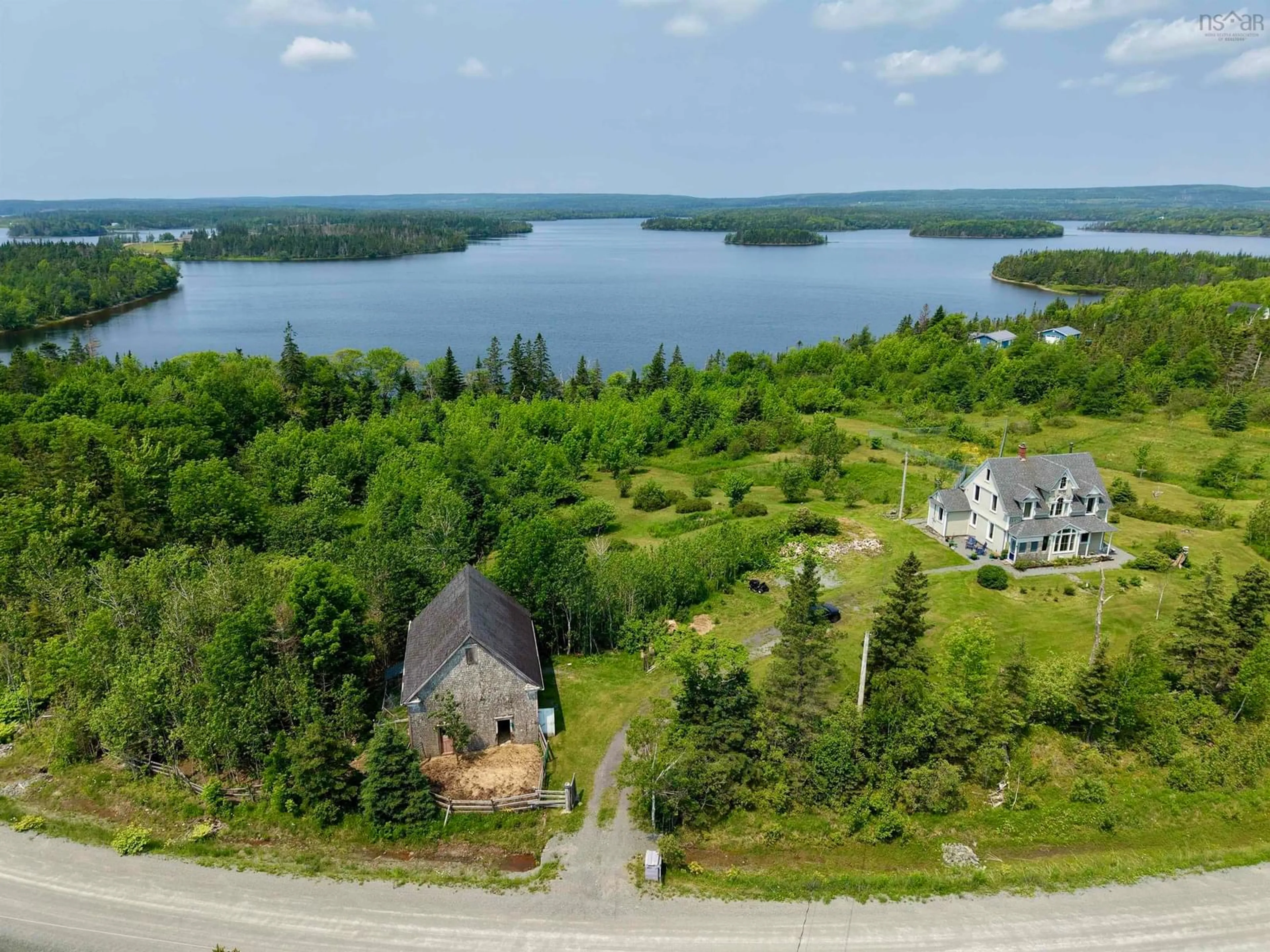 A pic from outside/outdoor area/front of a property/back of a property/a pic from drone, water/lake/river/ocean view for 3463 Loch Lomond Rd., Loch Lomond Nova Scotia B2E 1C5