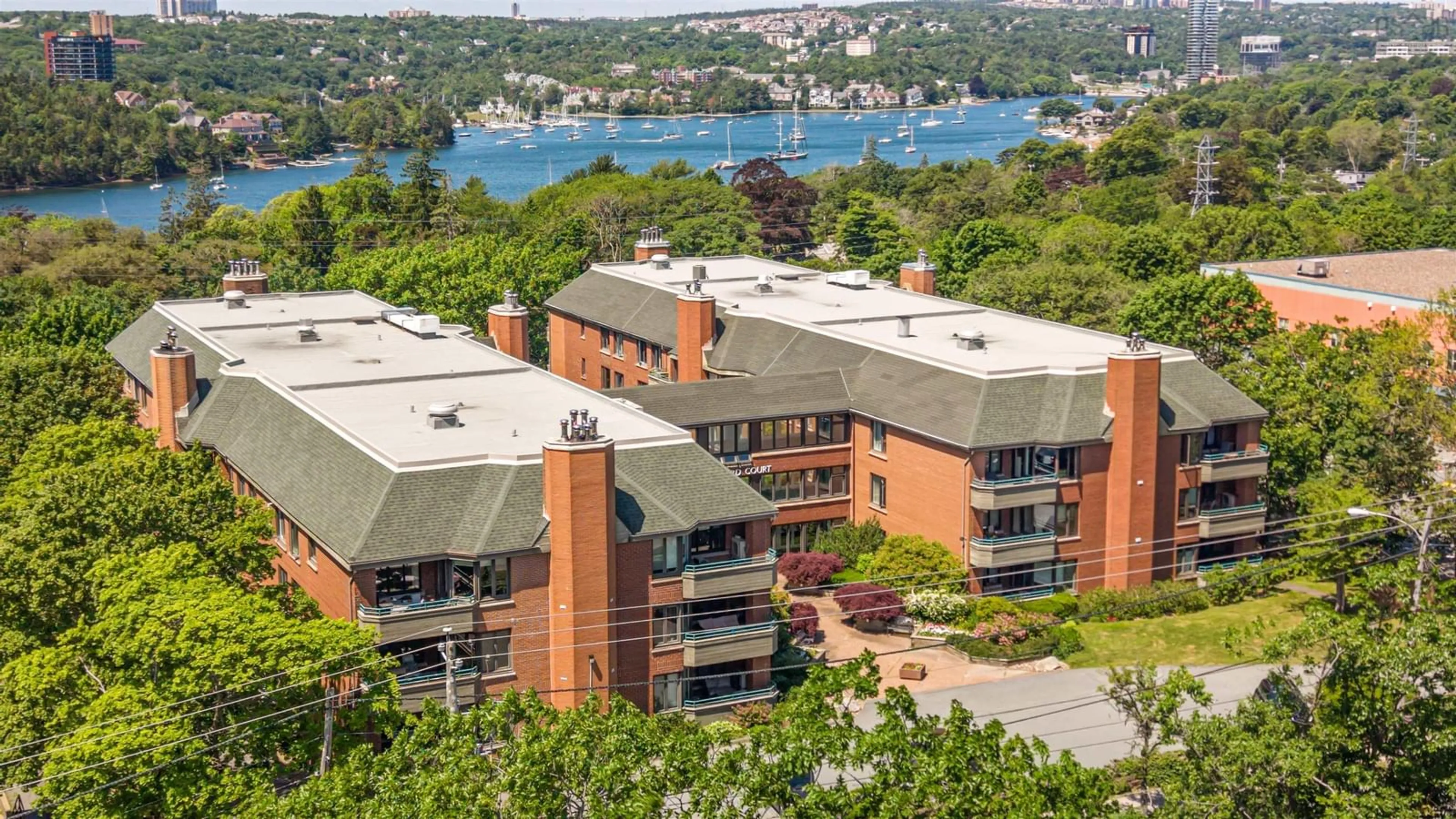 A pic from outside/outdoor area/front of a property/back of a property/a pic from drone, water/lake/river/ocean view for 1350 Oxford St #207, Halifax Nova Scotia B3H 3Y8