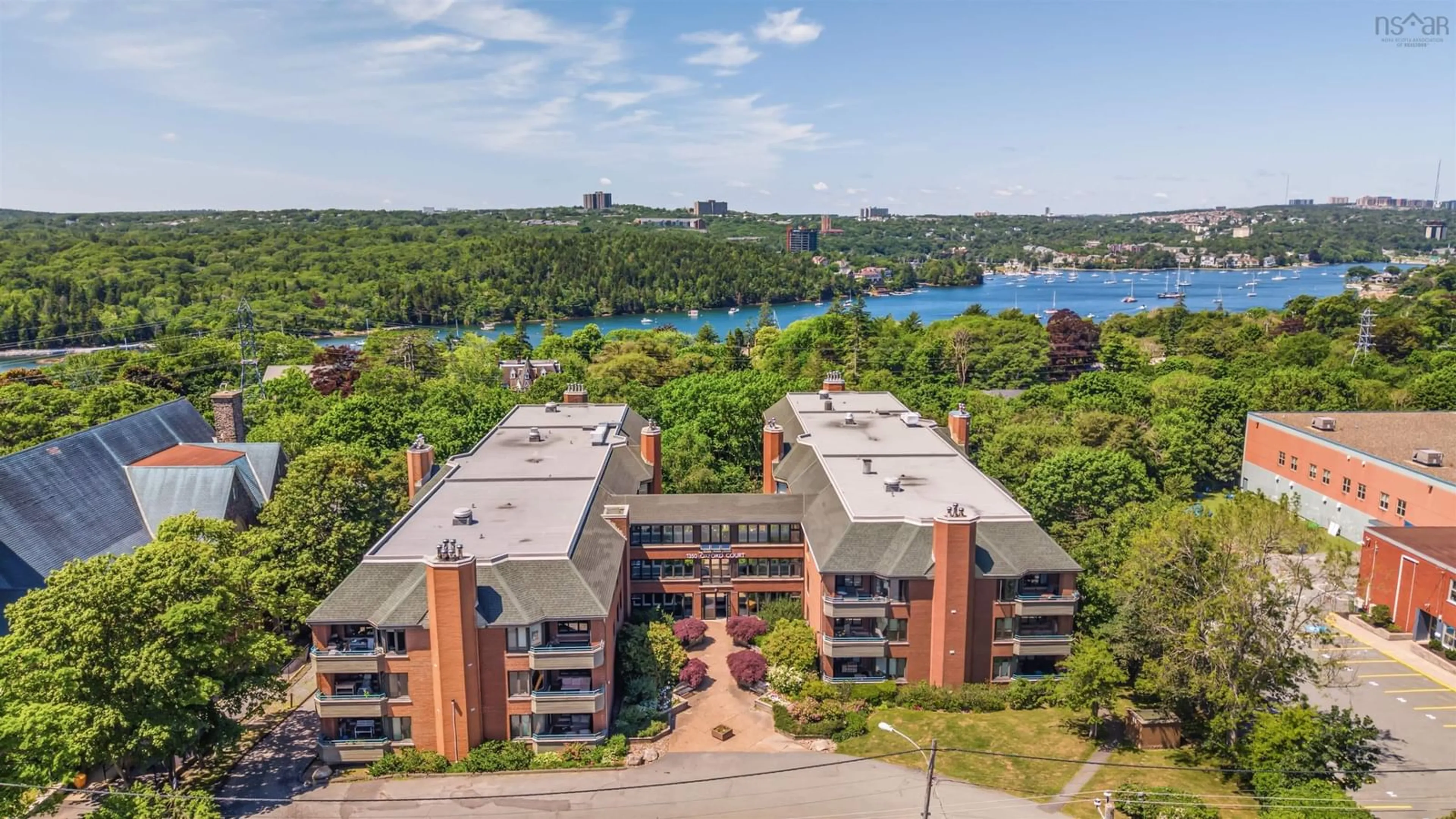 A pic from outside/outdoor area/front of a property/back of a property/a pic from drone, water/lake/river/ocean view for 1350 Oxford St #207, Halifax Nova Scotia B3H 3Y8