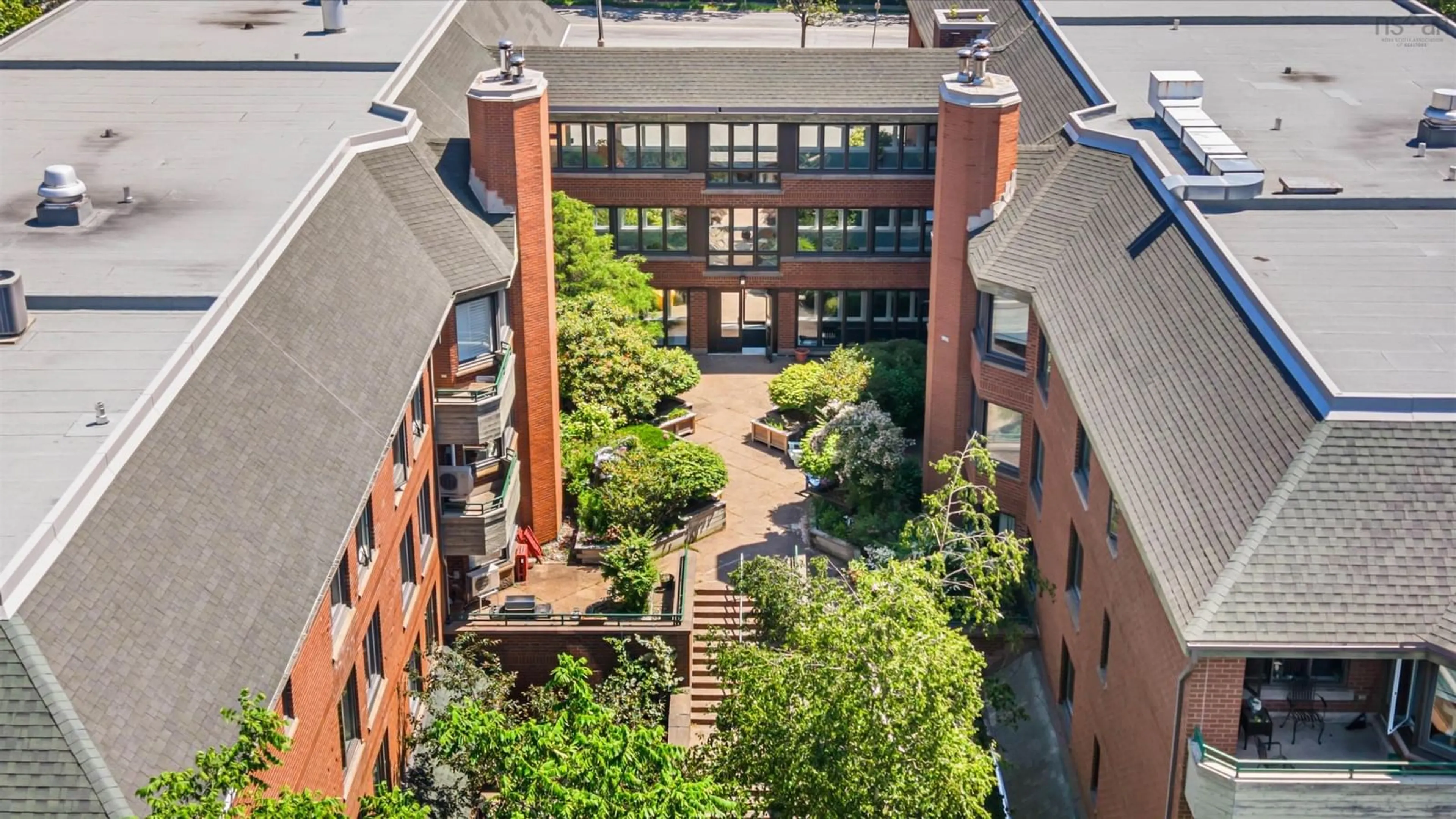 A pic from outside/outdoor area/front of a property/back of a property/a pic from drone, city buildings view from balcony for 1350 Oxford St #207, Halifax Nova Scotia B3H 3Y8