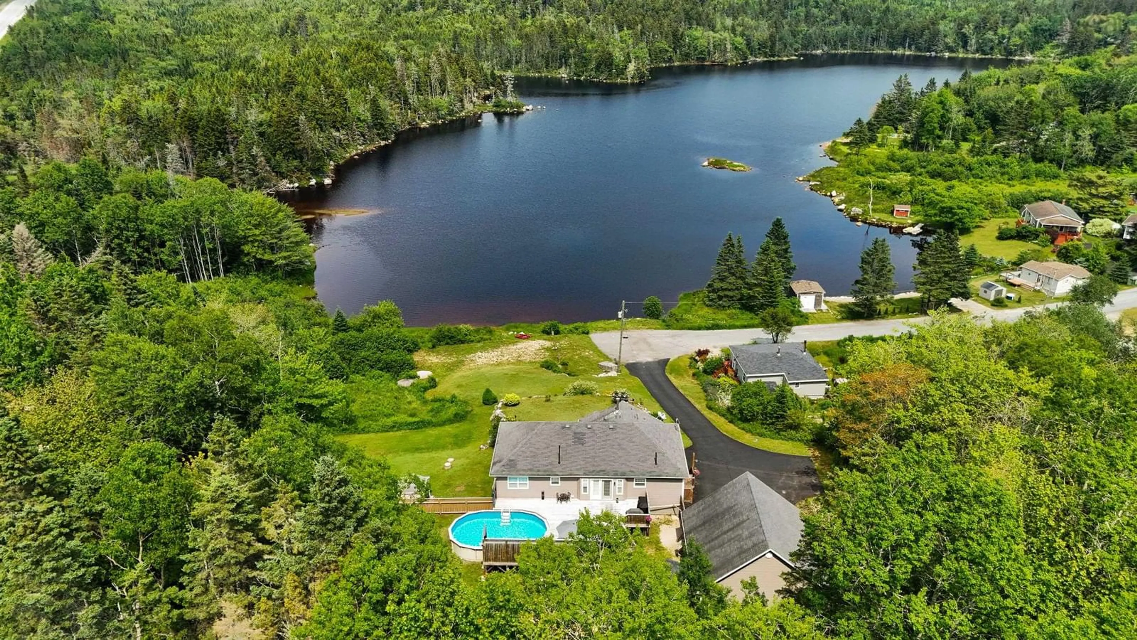 A pic from outside/outdoor area/front of a property/back of a property/a pic from drone, water/lake/river/ocean view for 212 Puddle Rd, Queensland Nova Scotia B0J 1T0