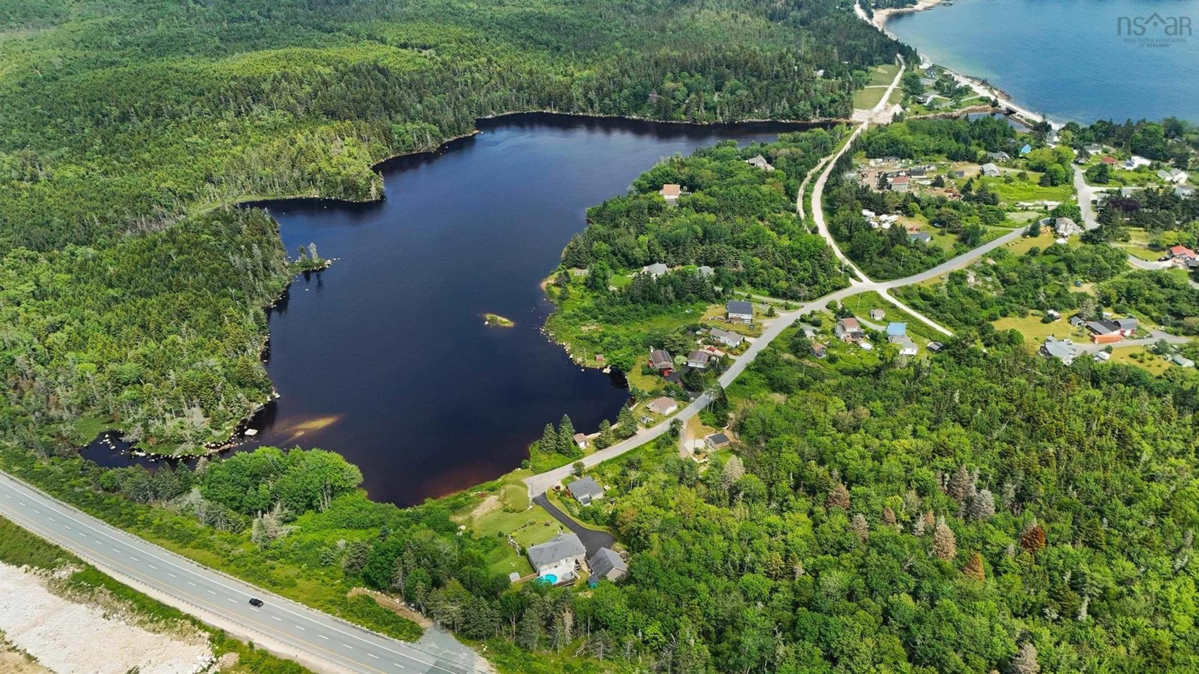 A pic from outside/outdoor area/front of a property/back of a property/a pic from drone, water/lake/river/ocean view for 212 Puddle Rd, Queensland Nova Scotia B0J 1T0