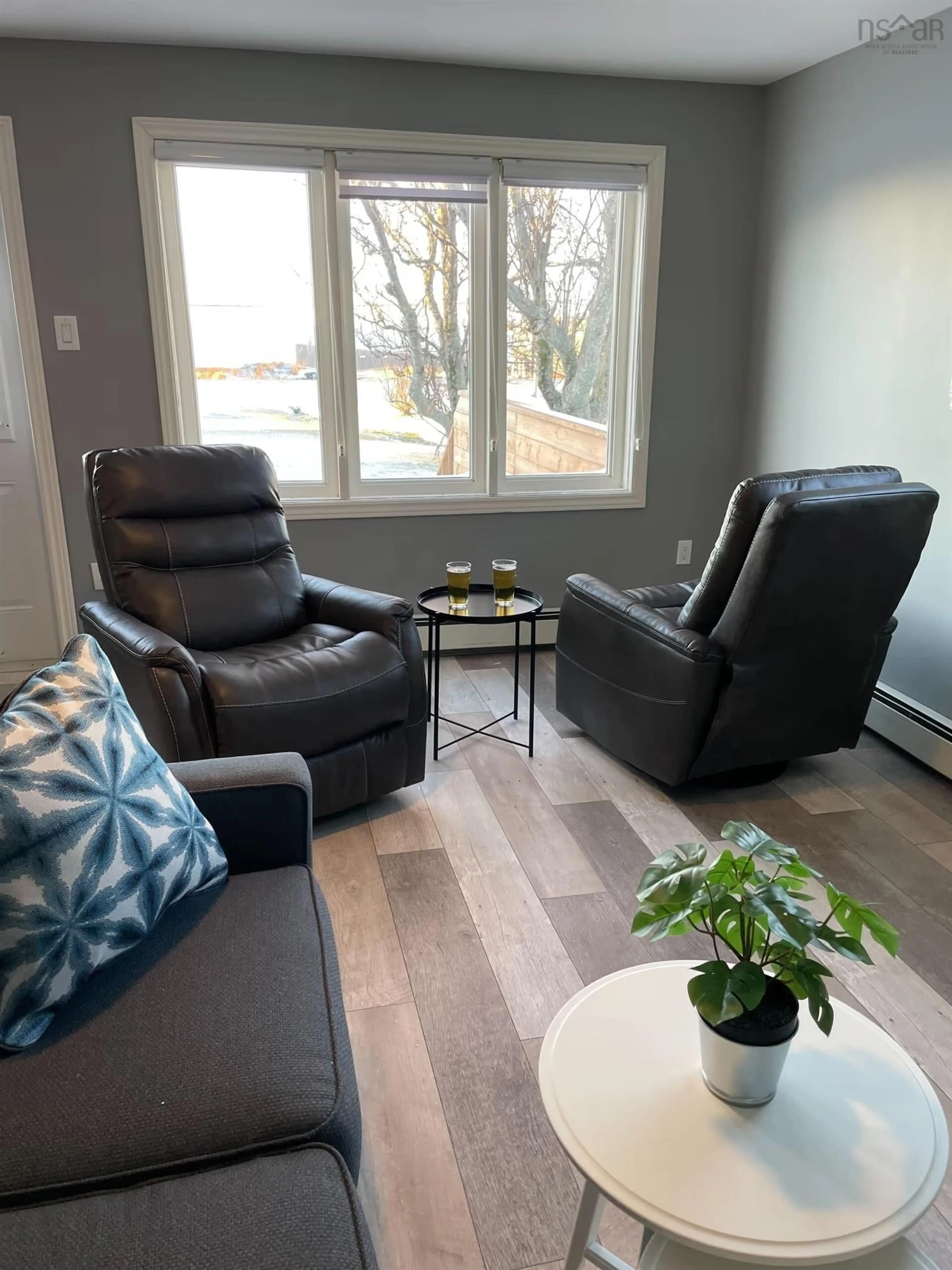 Living room with furniture, wood/laminate floor for 15 Allen J Memorial Ave, Inverness Nova Scotia B0E 1N0