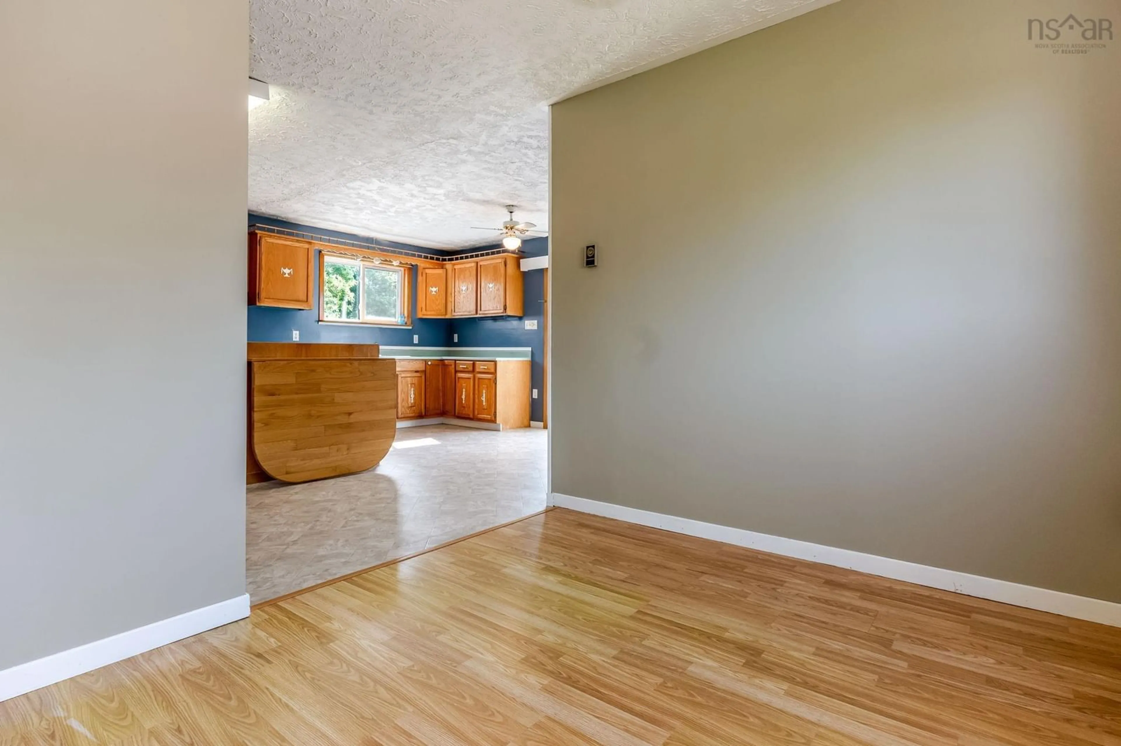 Open concept kitchen, wood/laminate floor for 175 Centennial Dr, Bridgetown Nova Scotia B0S 1C0